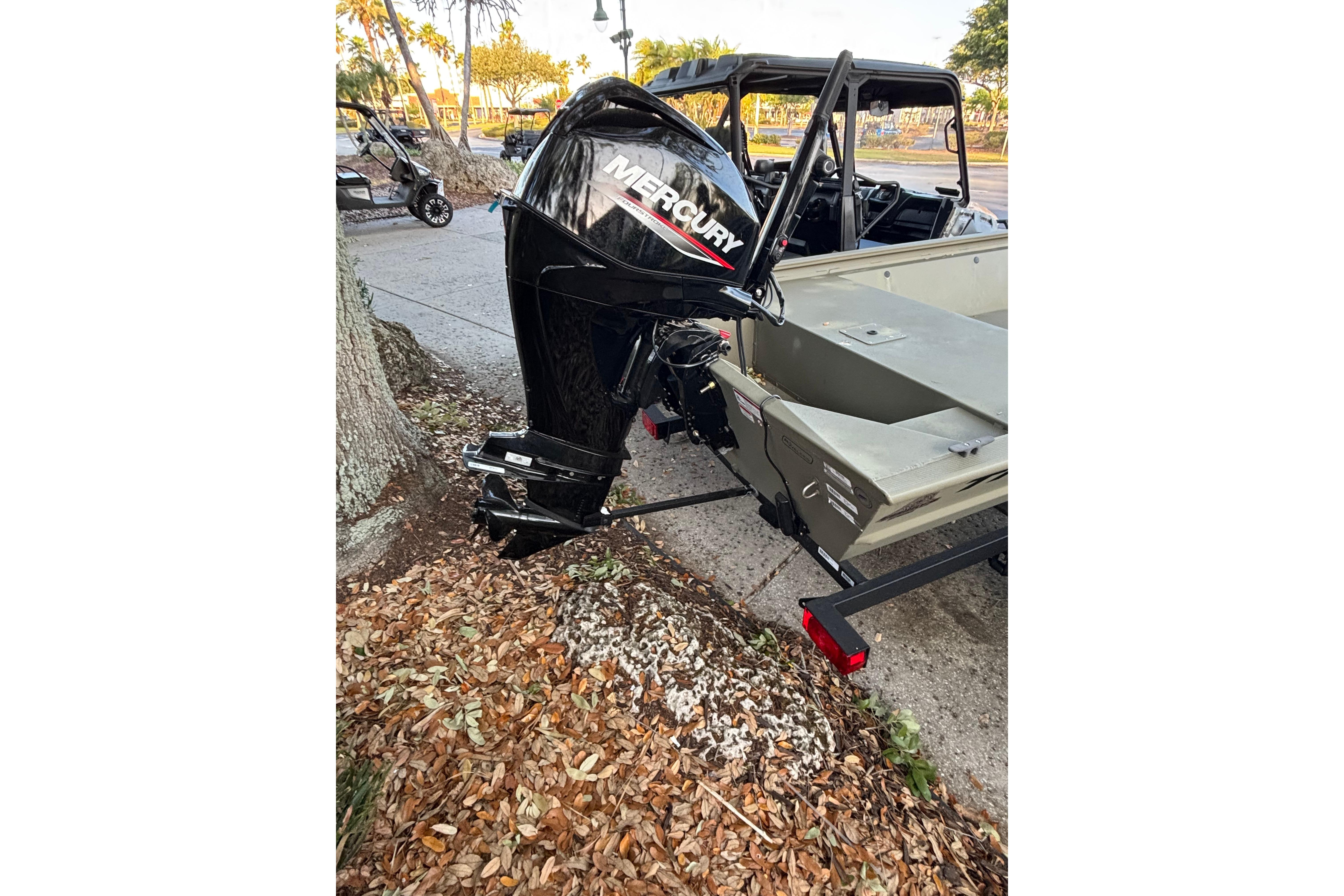 2025 Tracker Grizzly 1648 Jon boat with Mercury outboard motor on a trailer.