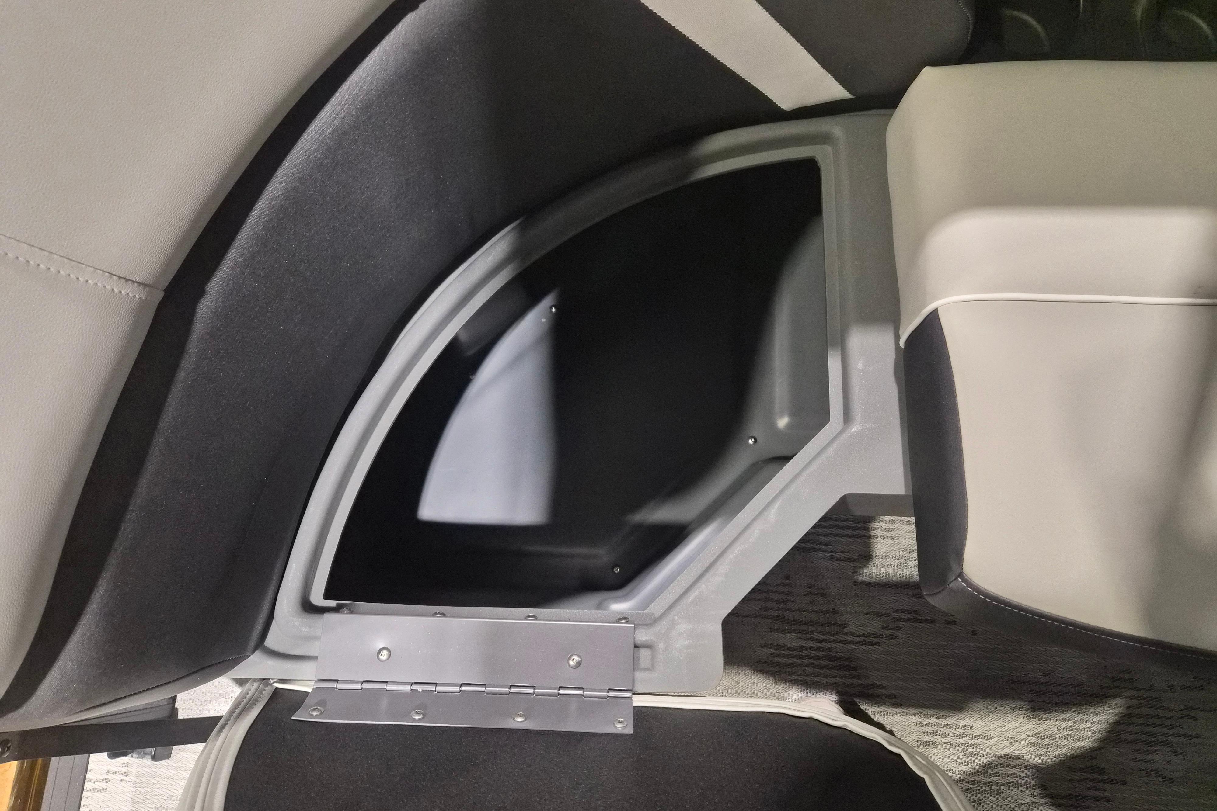 Storage compartment in 2026 Sylvan R-22 LZ DH boat, featuring sleek interior design.