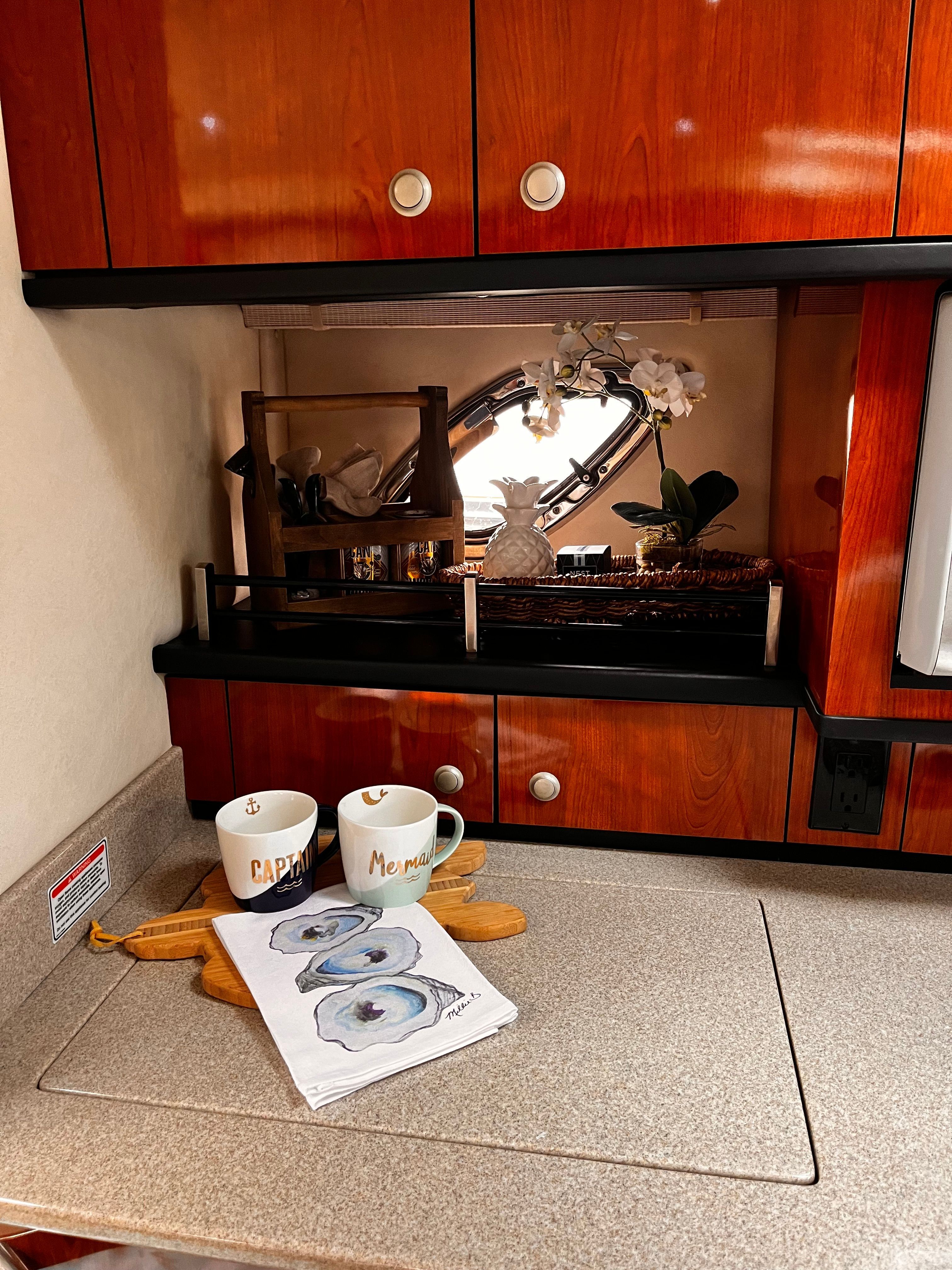 Interior of 2007 Sea Ray Sundancer 310 yacht with elegant kitchenette.