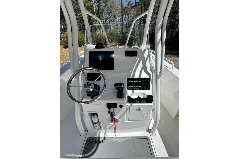 2021 Edgewater 208CC boat console with steering wheel and control panel.