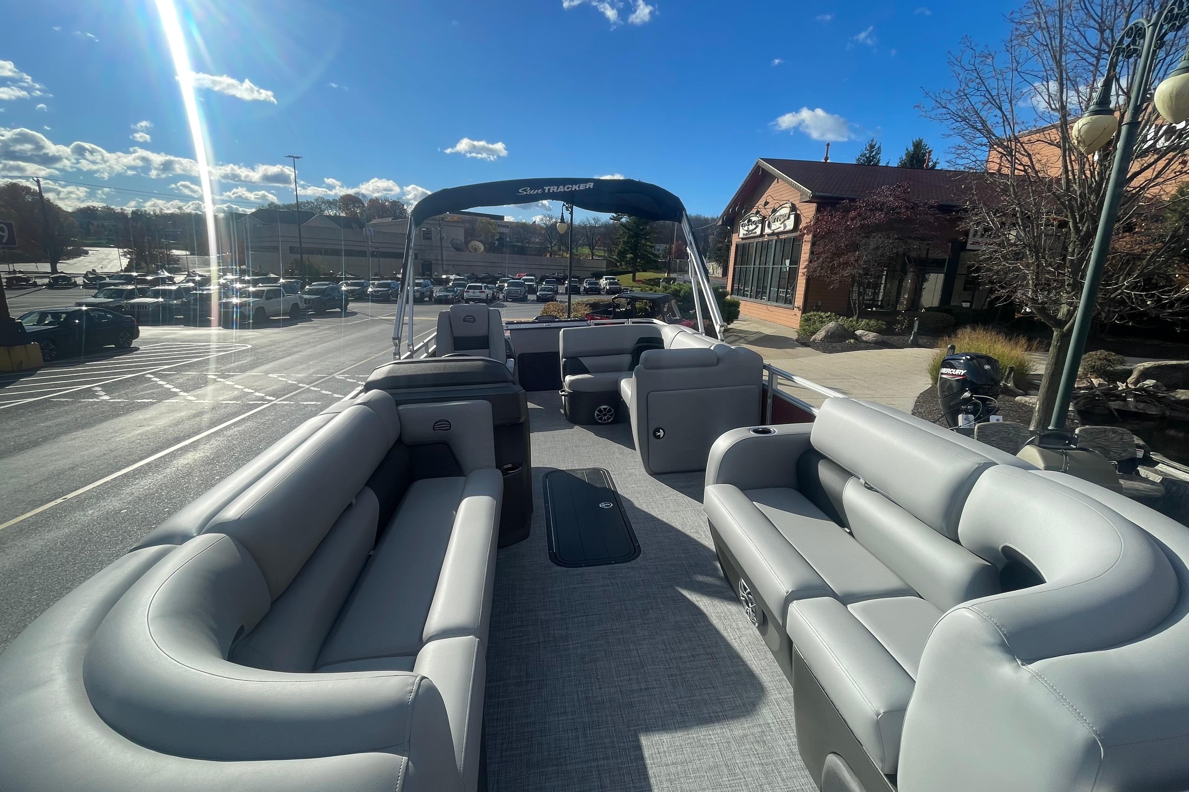 2026 Sun Tracker SportFish 22 XP3 pontoon boat with spacious seating and modern design.