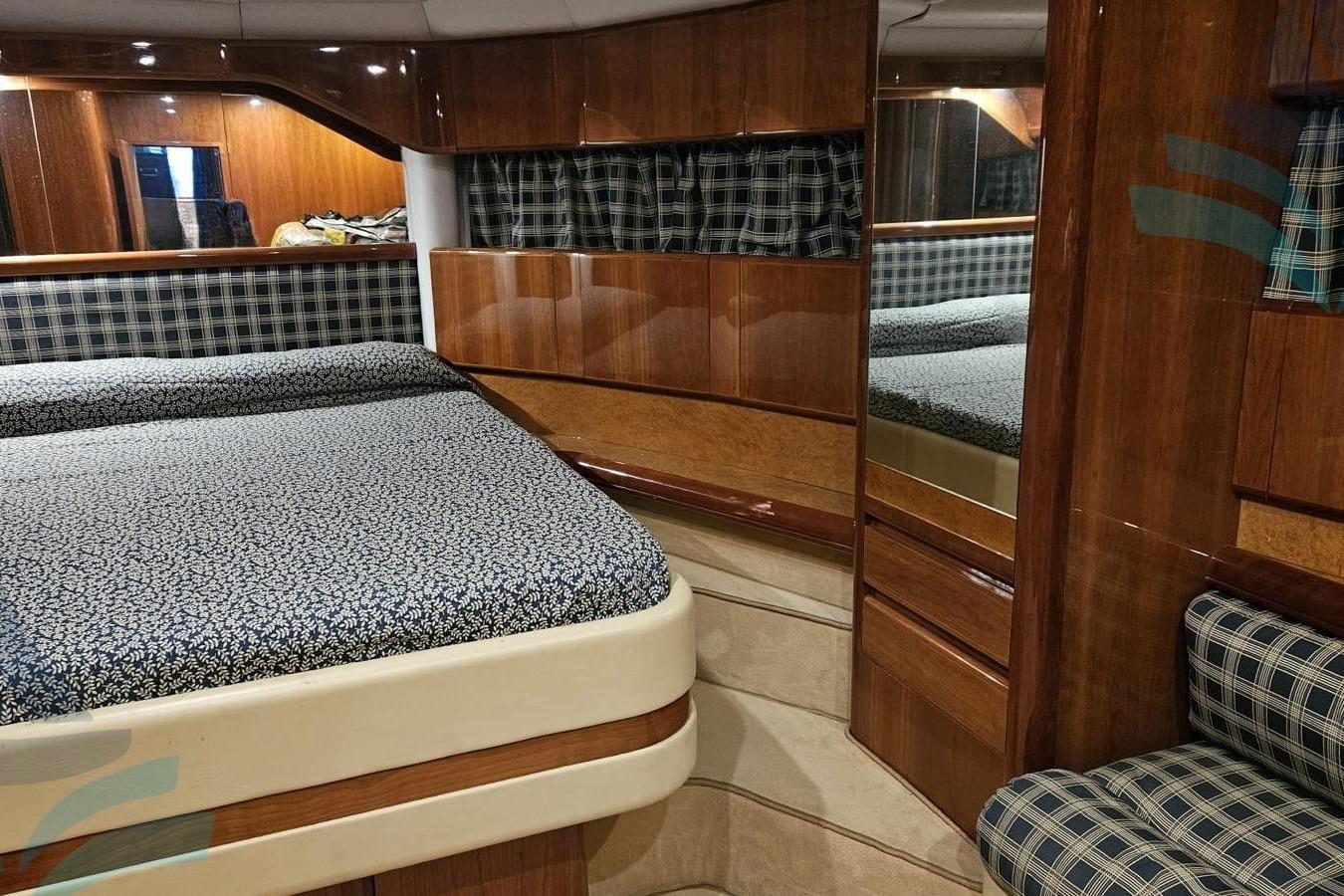 Luxurious 1995 C.N. VZ S.r.l. VZ 18 yacht interior with elegant wood finish.