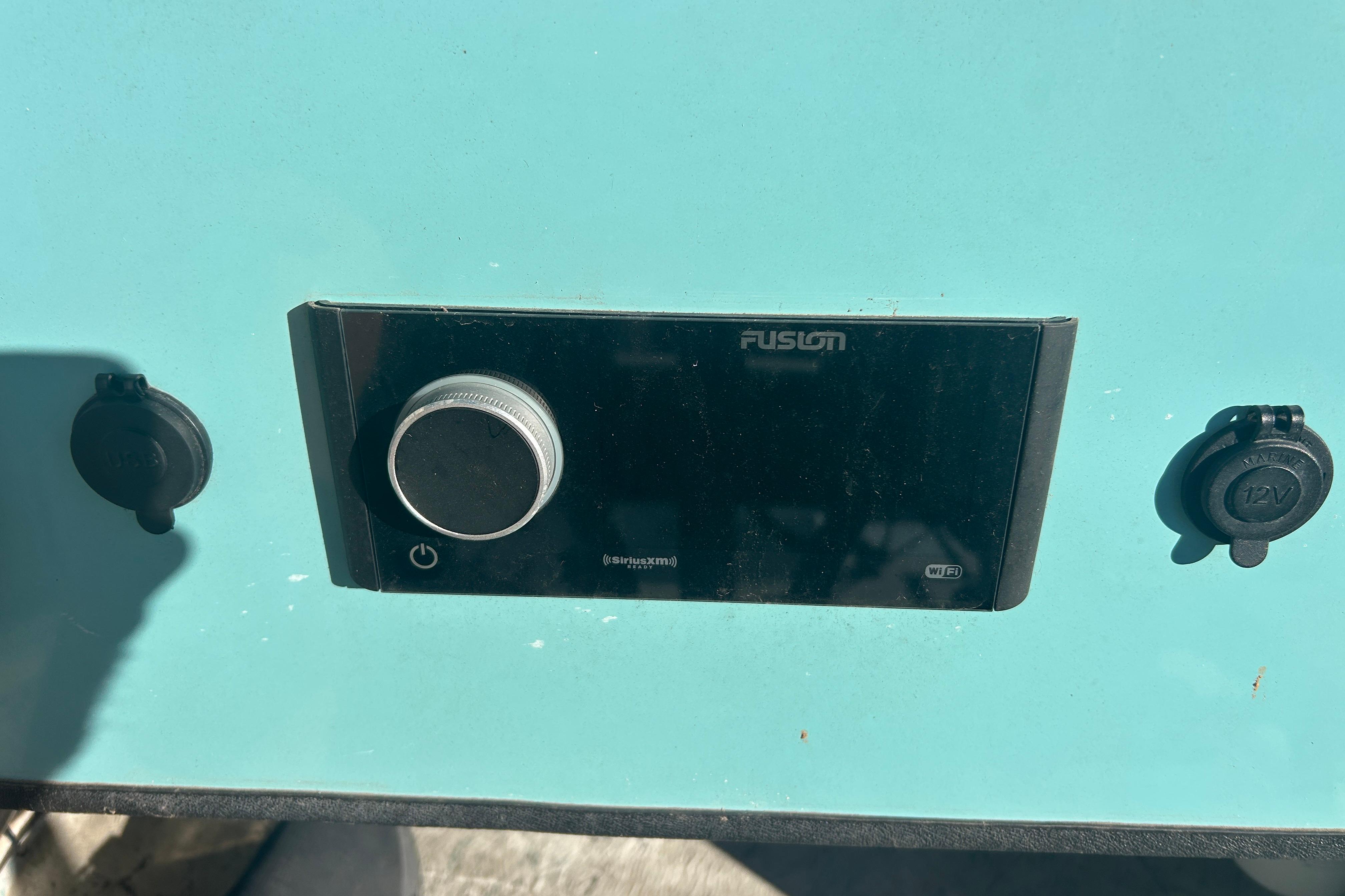 Control panel on 2021 Shallow Stalker Cat 240 Pro Elite boat, featuring Fusion audio system.