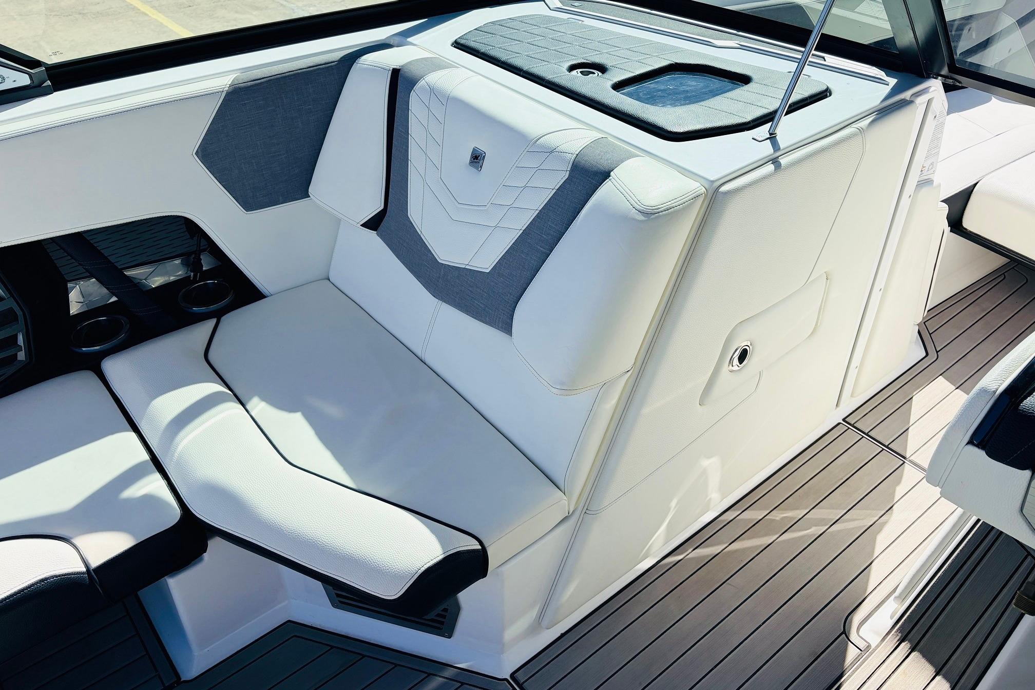 2023 Nautique Super Air Nautique G25 interior seating with modern design and cup holders.
