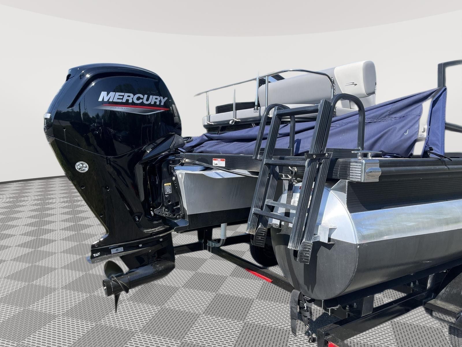A 2025 Bennington S20 pontoon boat with a Mercury outboard motor.