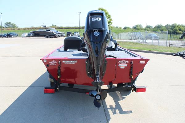 2025 Tracker Bass Tracker Classic XL boat with 50 HP motor, parked outdoors.