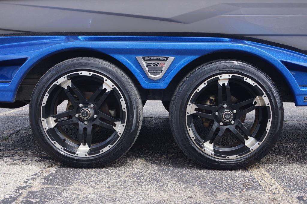 2020 Skeeter FXR21 Limited trailer with stylish black alloy wheels.