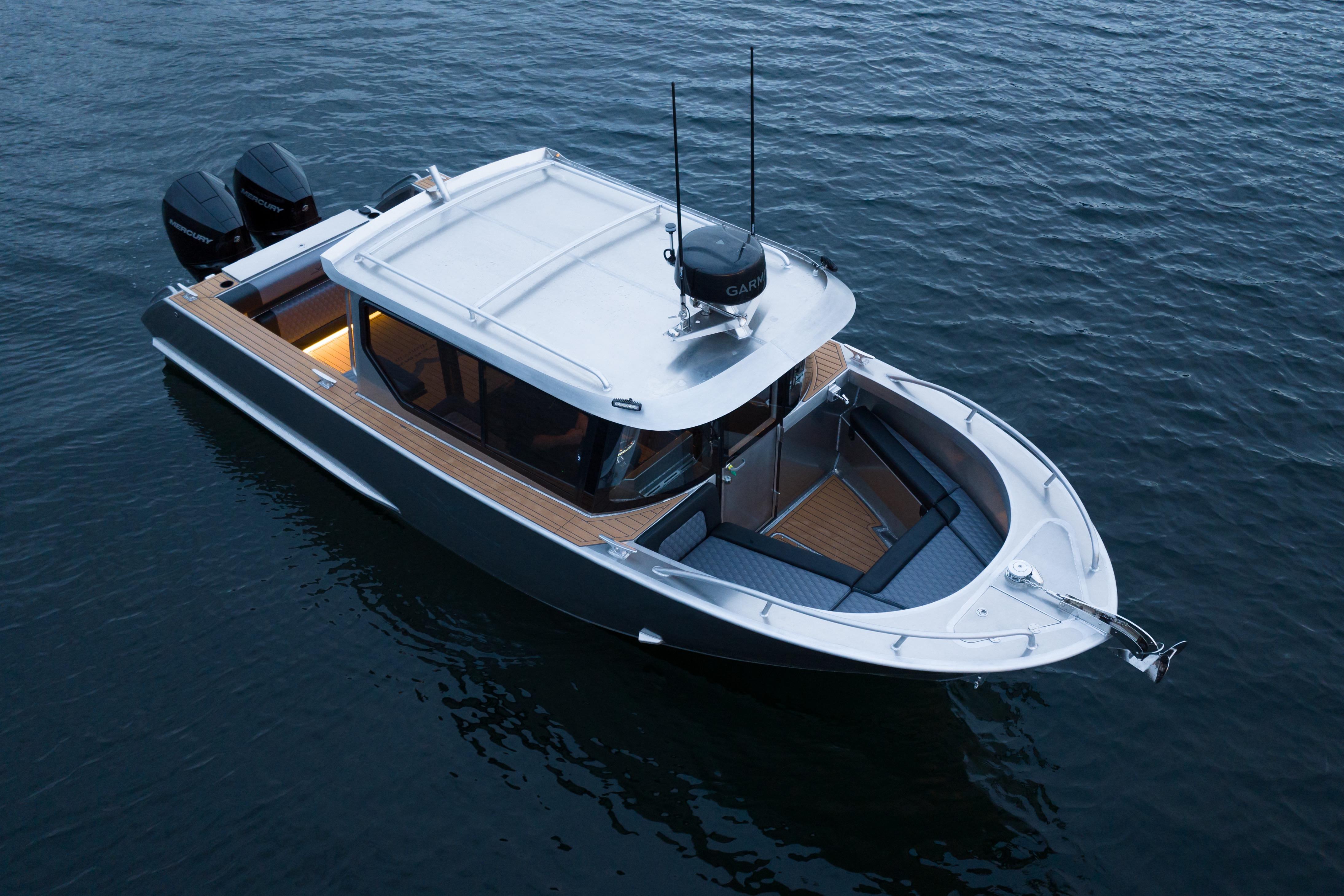 2026 Jasper Marine Defender 22 boat on water, featuring sleek design and dual engines.
