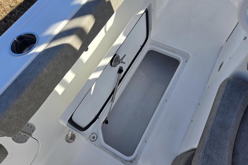 2026 Sea Hunt Ultra 275 Coffin Box open storage compartment with cushioned seating.