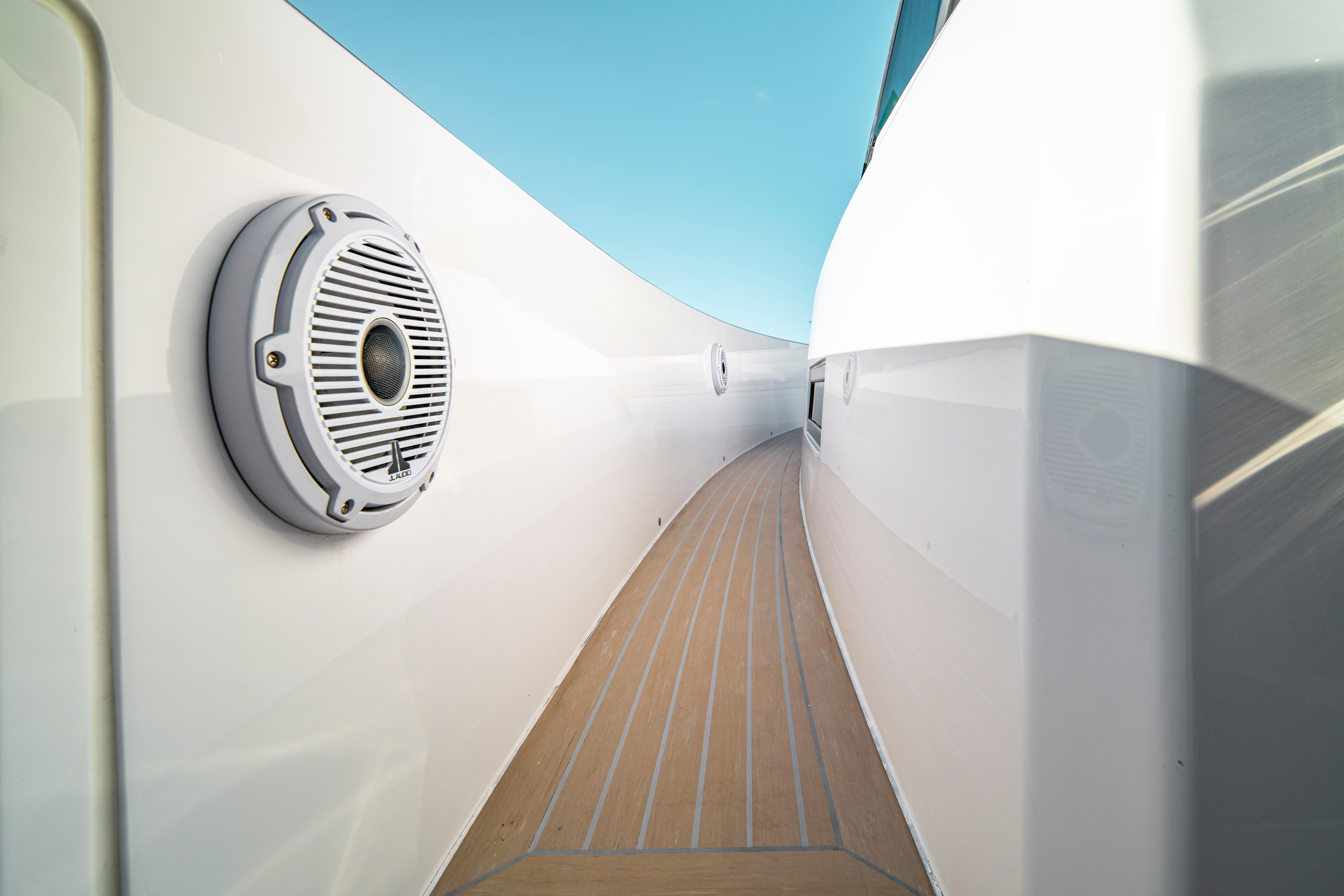 2024 Pardo Yachts P43 deck with speaker, sleek design, and clear blue sky.