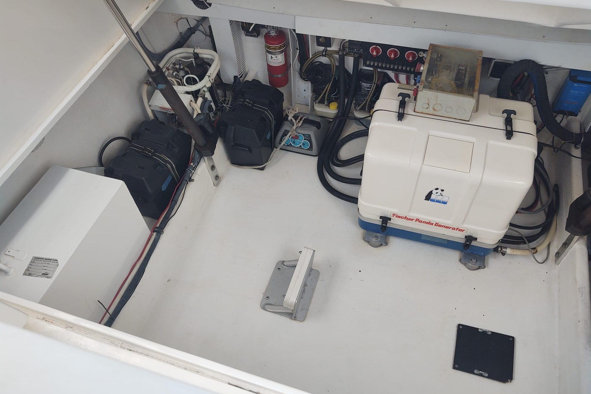 Engine room of 2008 Contender 35 Express Side Console with generator and equipment.