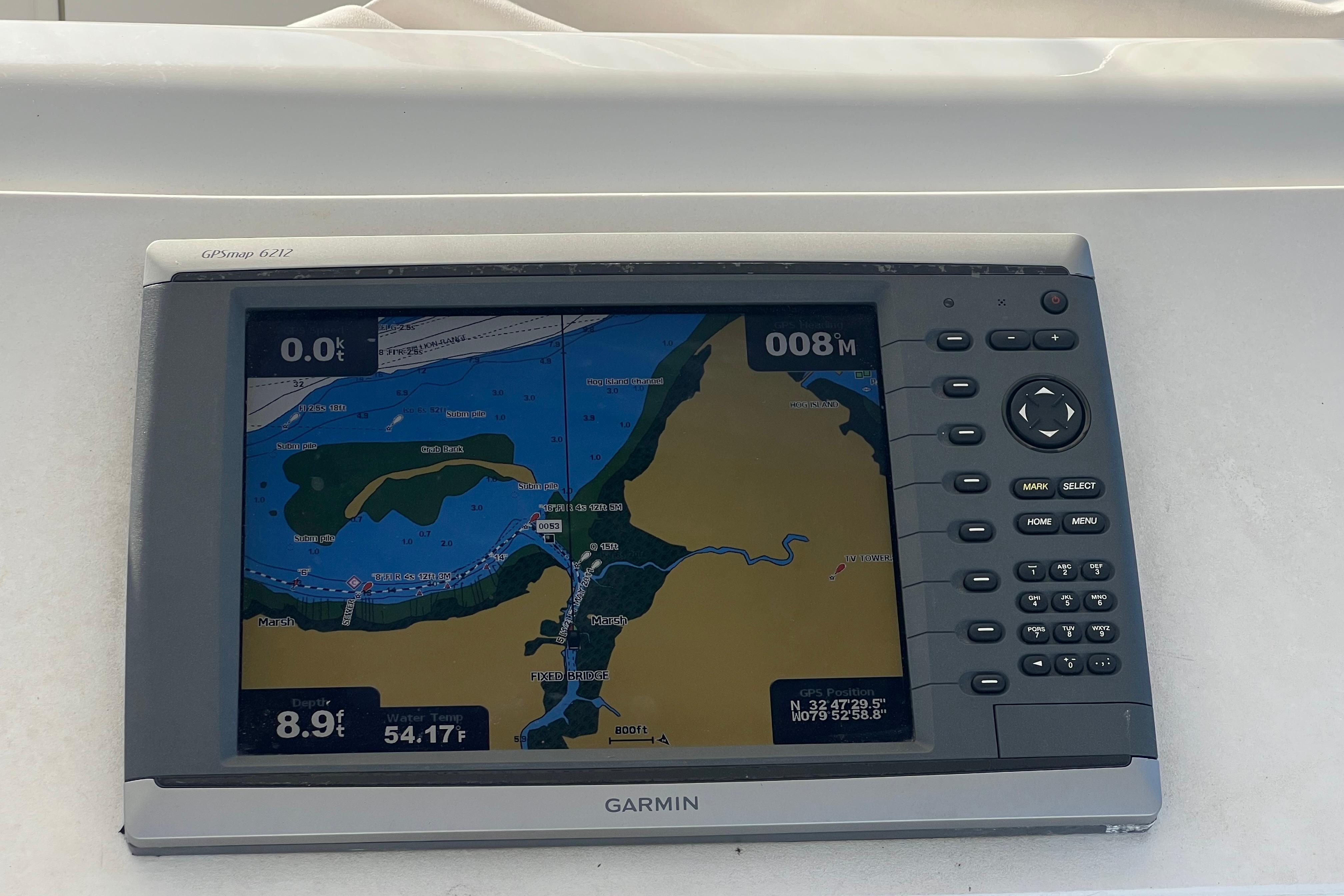 Garmin GPS display on 1996 Ocean Yachts 48 Super Sport, showing nautical map and coordinates.