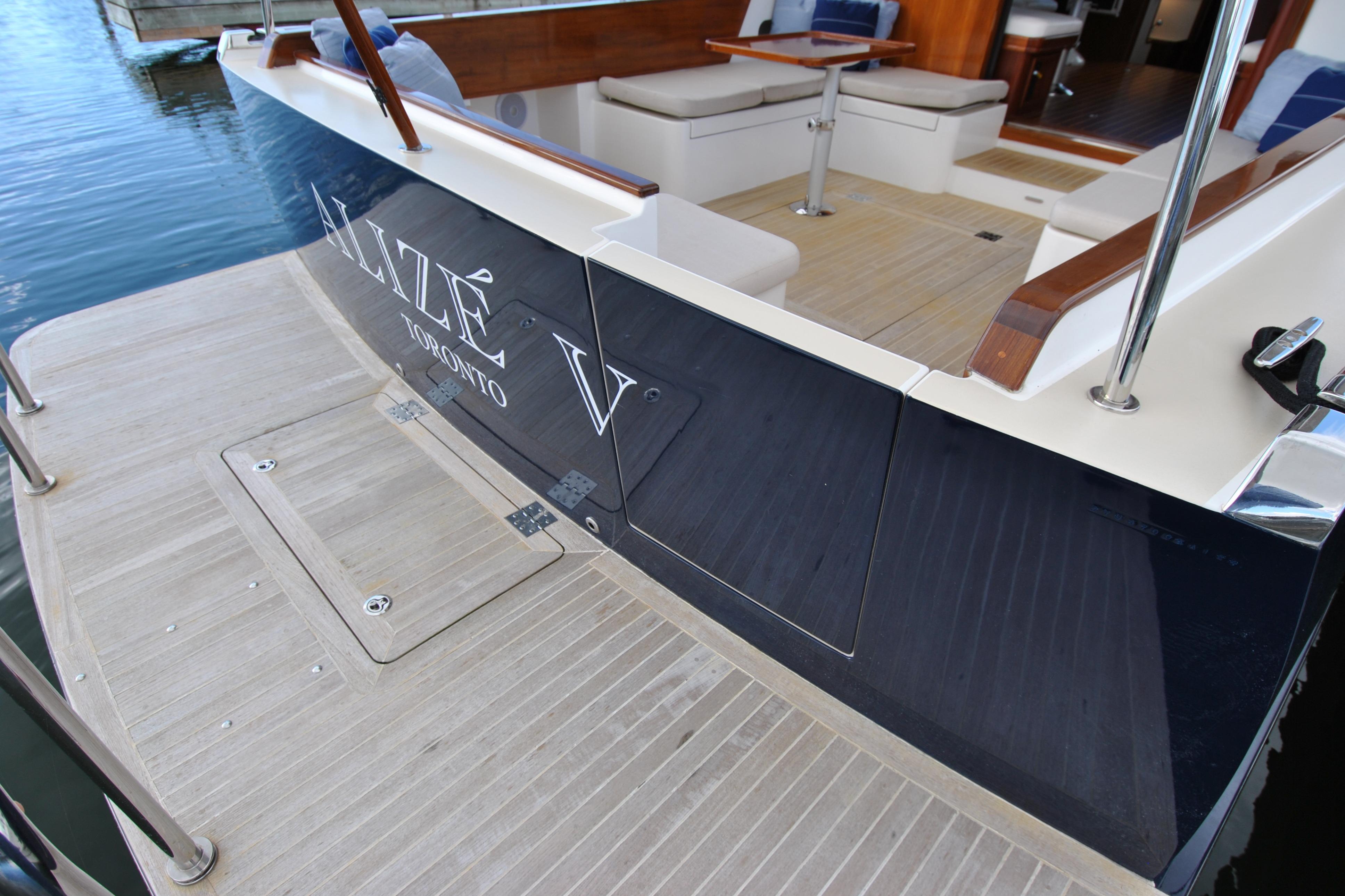Luxury Bruckmann Abaco 50 yacht, 2024 model, docked with elegant seating area.