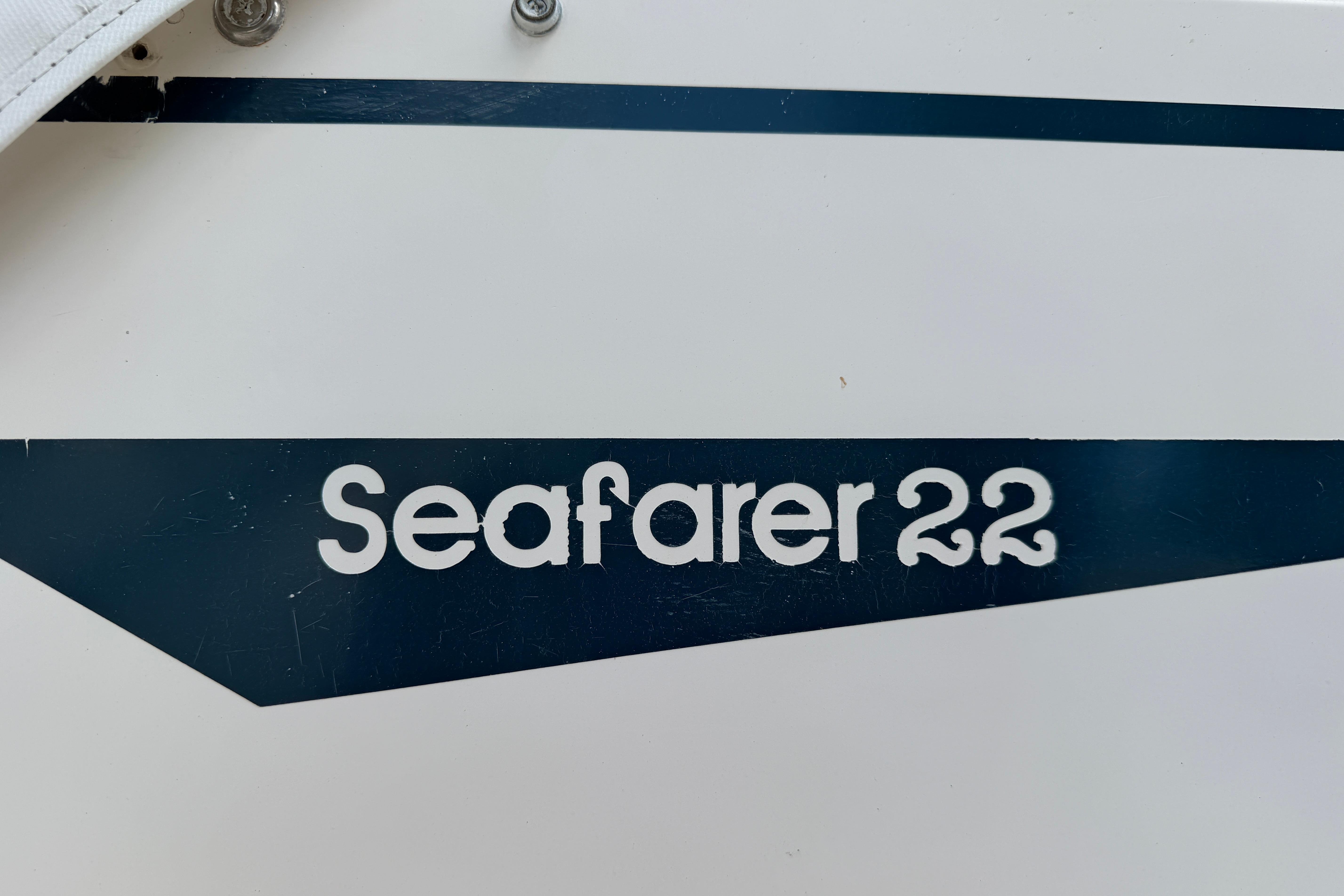 1987 Grady-White Seafarer 226 boat logo on white surface.