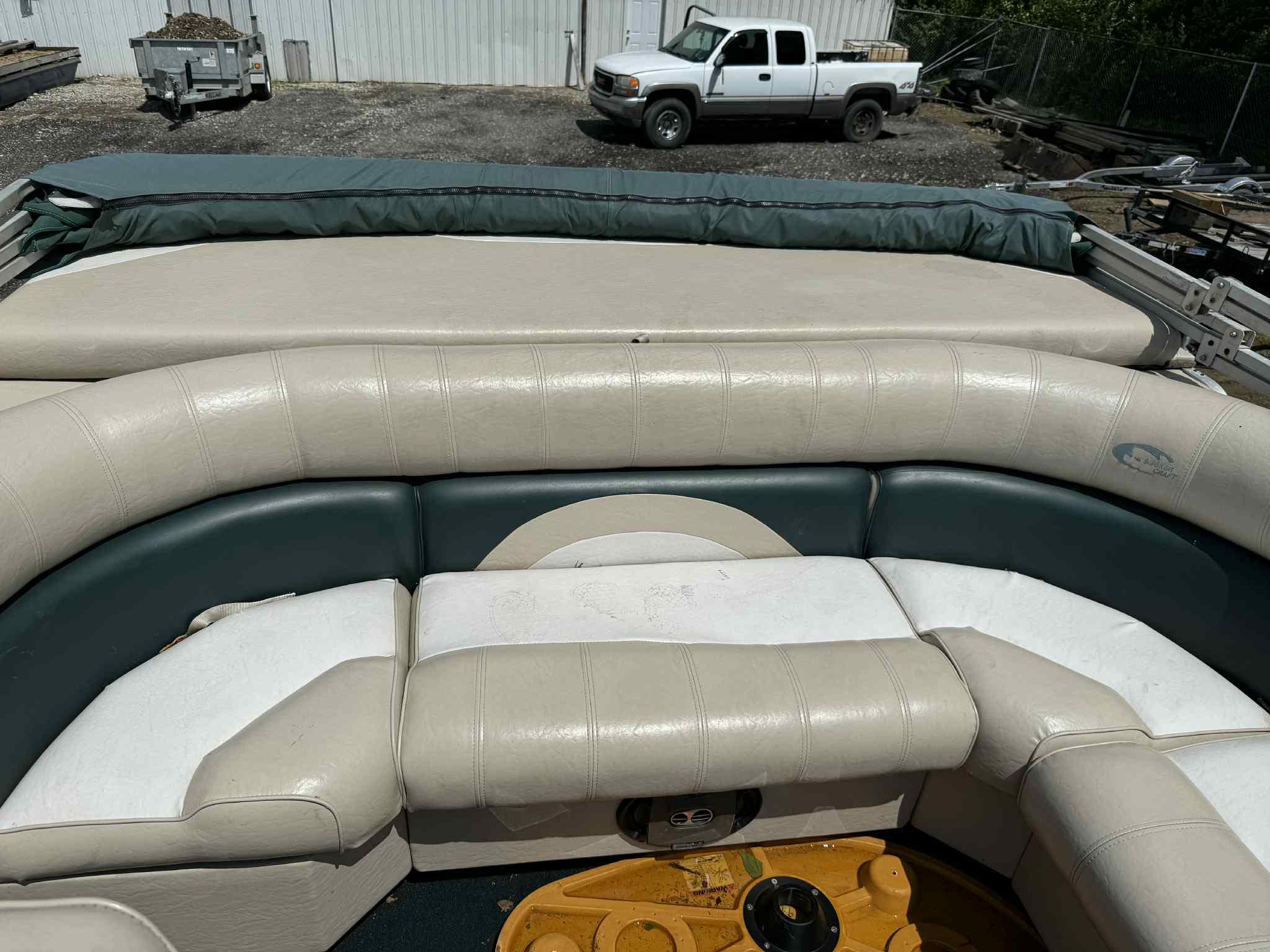 1999 Smoker Craft 8526 Pleasure Isle I/O boat interior with cushioned seating.