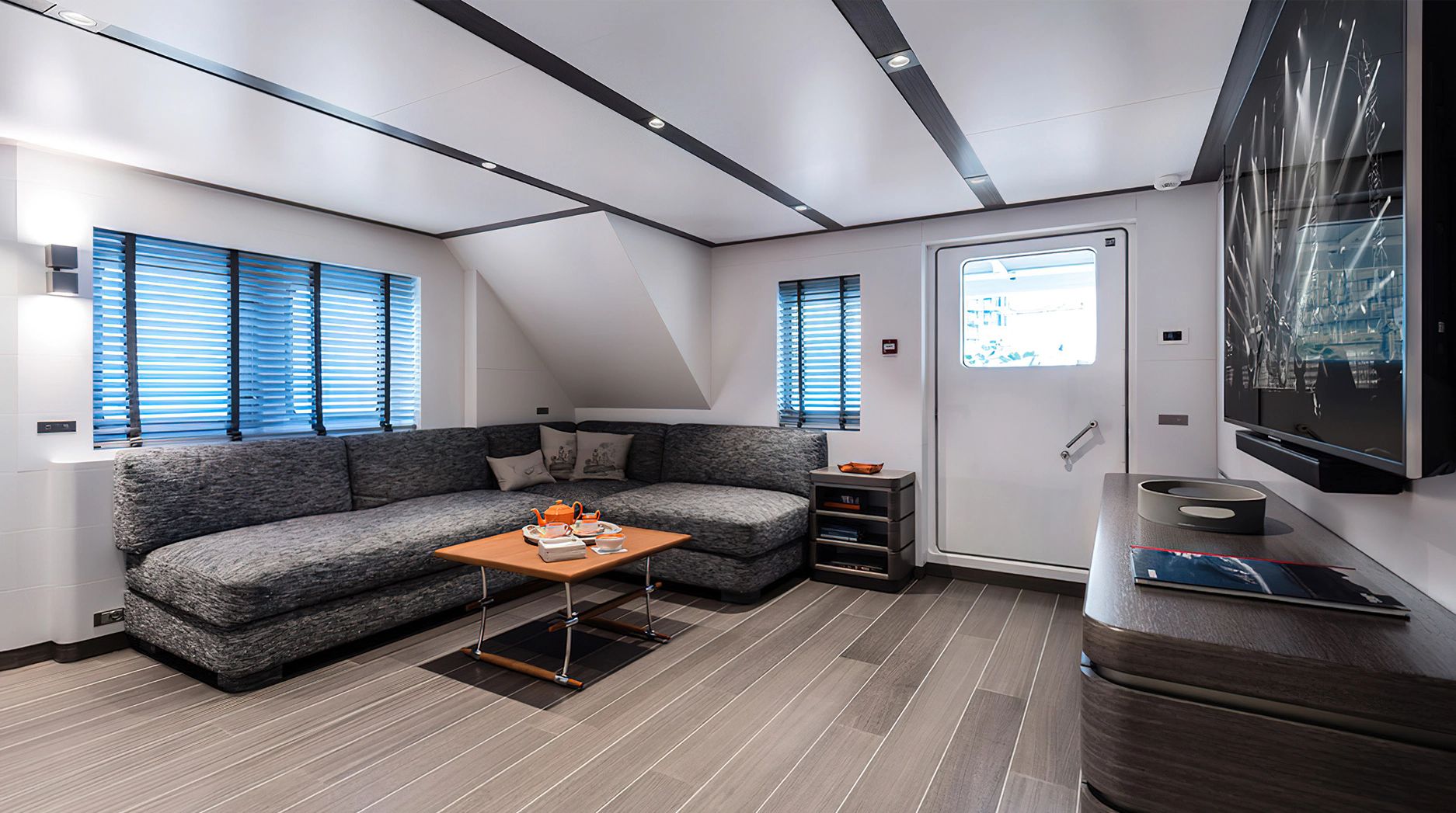 Interior of the 2028 Ocean King Explorer 130 with modern sofa and table.