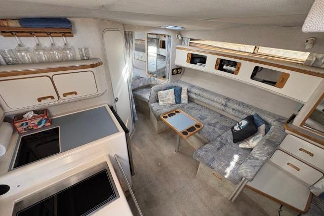Interior of a 1993 Sea Ray Sundancer 330 yacht with cozy seating and modern amenities.