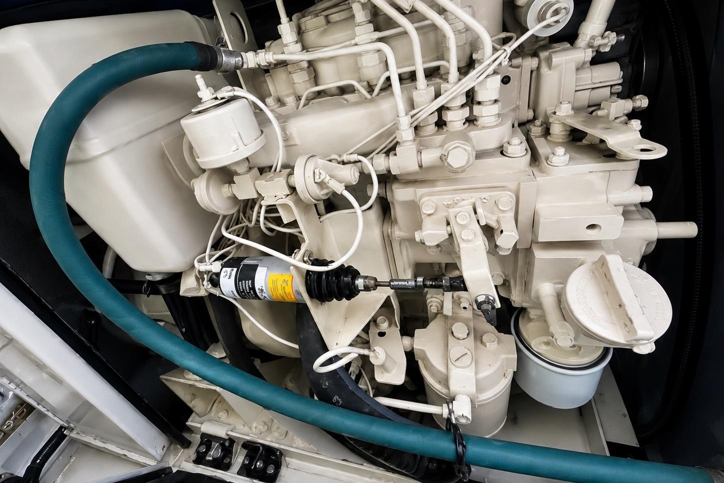 Engine compartment of a 1989 Grand Banks 42 Classic yacht, showcasing detailed mechanical components.