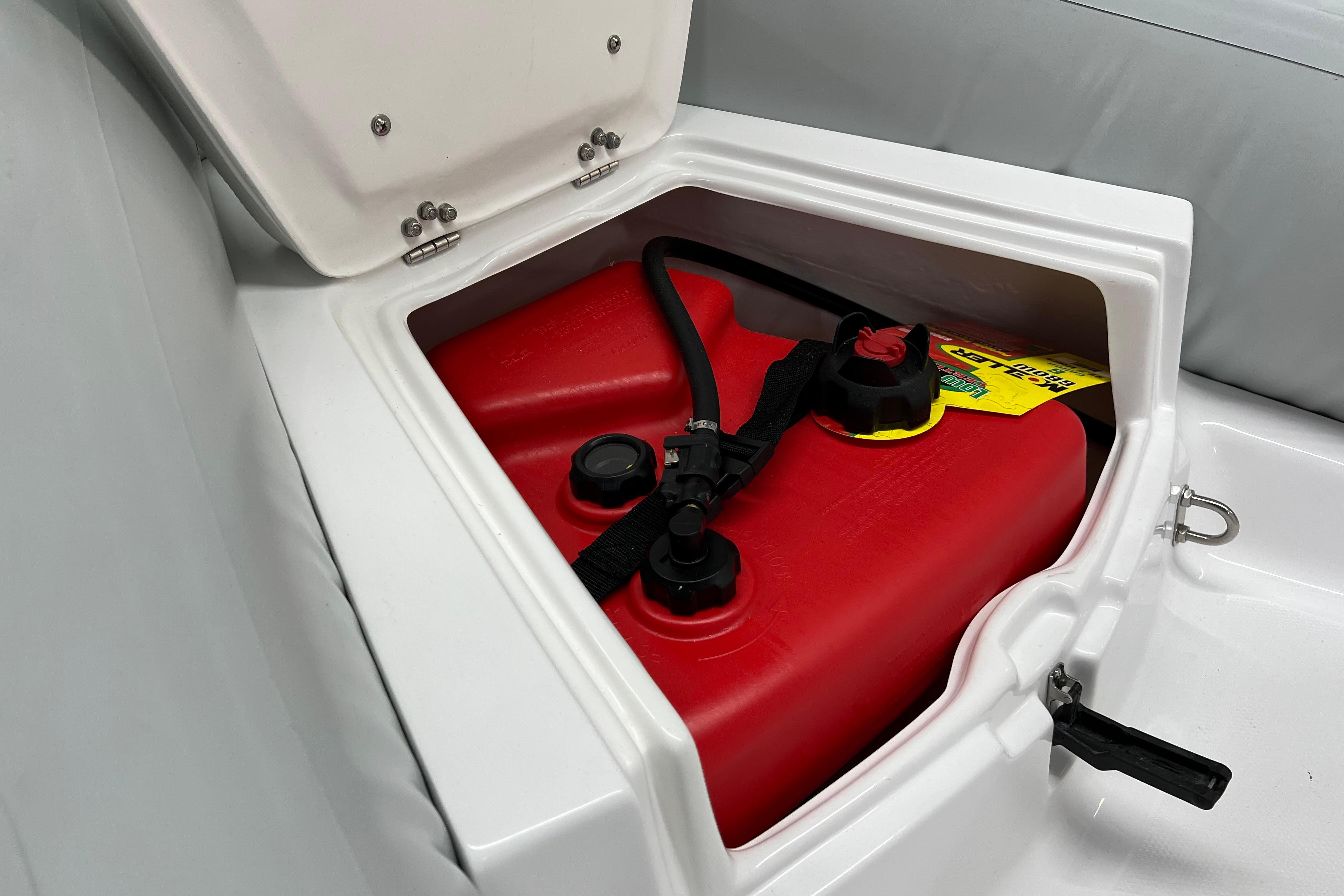 Fuel compartment of 2023 AB Inflatables Mares 11 VSX with red fuel tank.