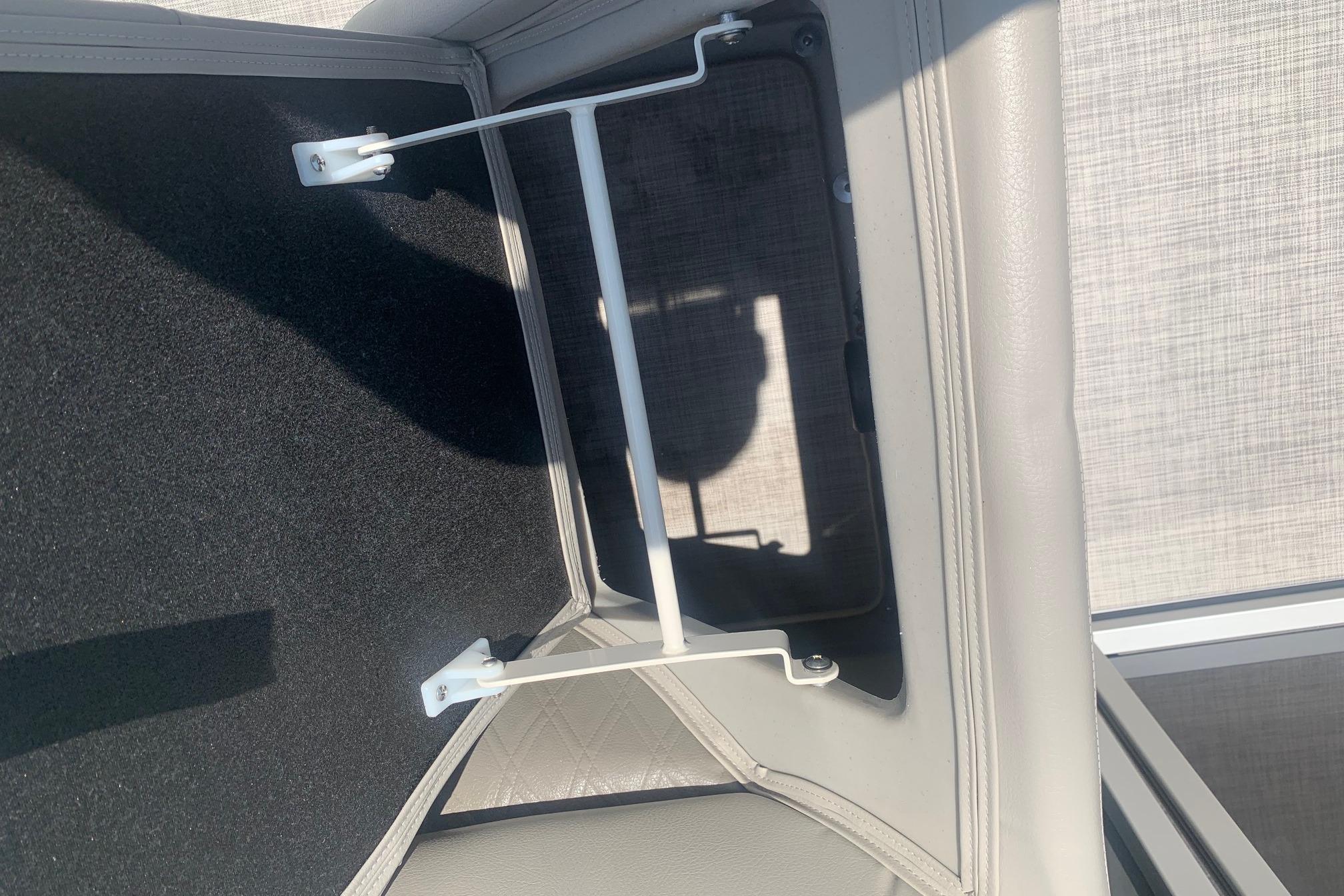 Storage compartment in 2023 Silver Wave 2410 SW3 CLS boat, featuring a secure latch mechanism.