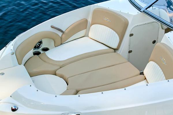 Manufacturer Provided Image: 2018 Stingray 214 LR boat with beige and white cushioned seating.