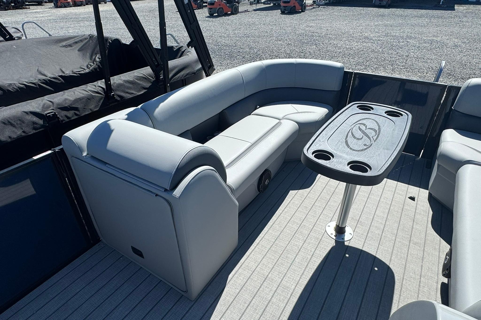 2026 Bentley Pontoons Legacy 243 Swingback interior with plush seating and table.