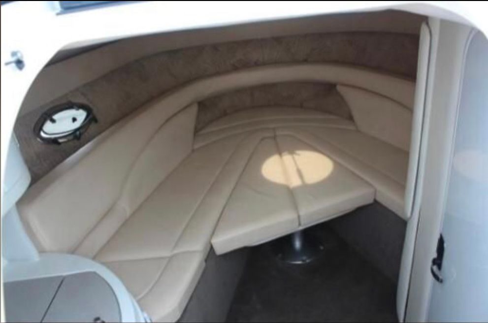 Interior of a 1999 Cobalt 293 boat with cushioned seating.