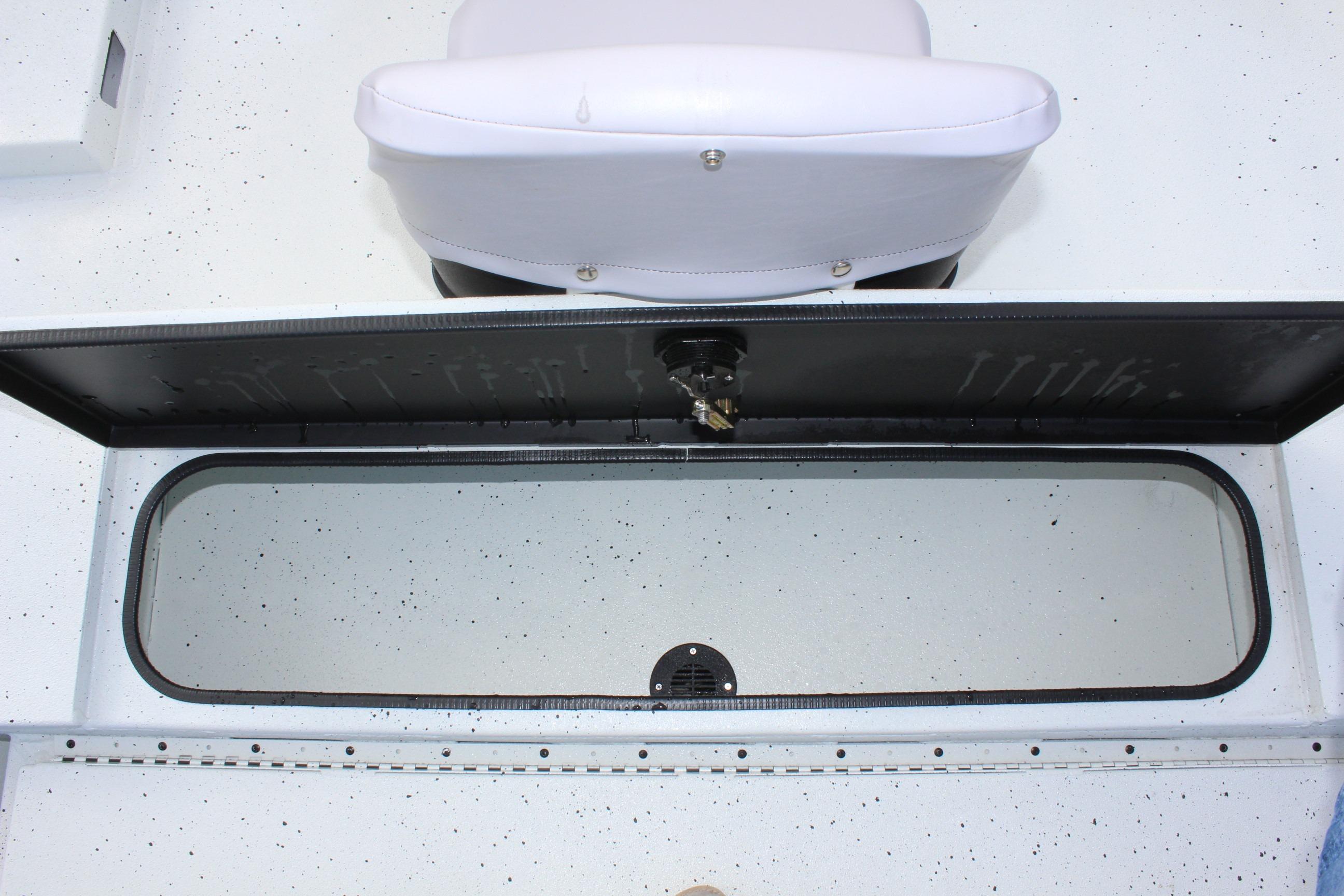 Open storage compartment in 2025 Excel 2172 Stalker CC boat interior.