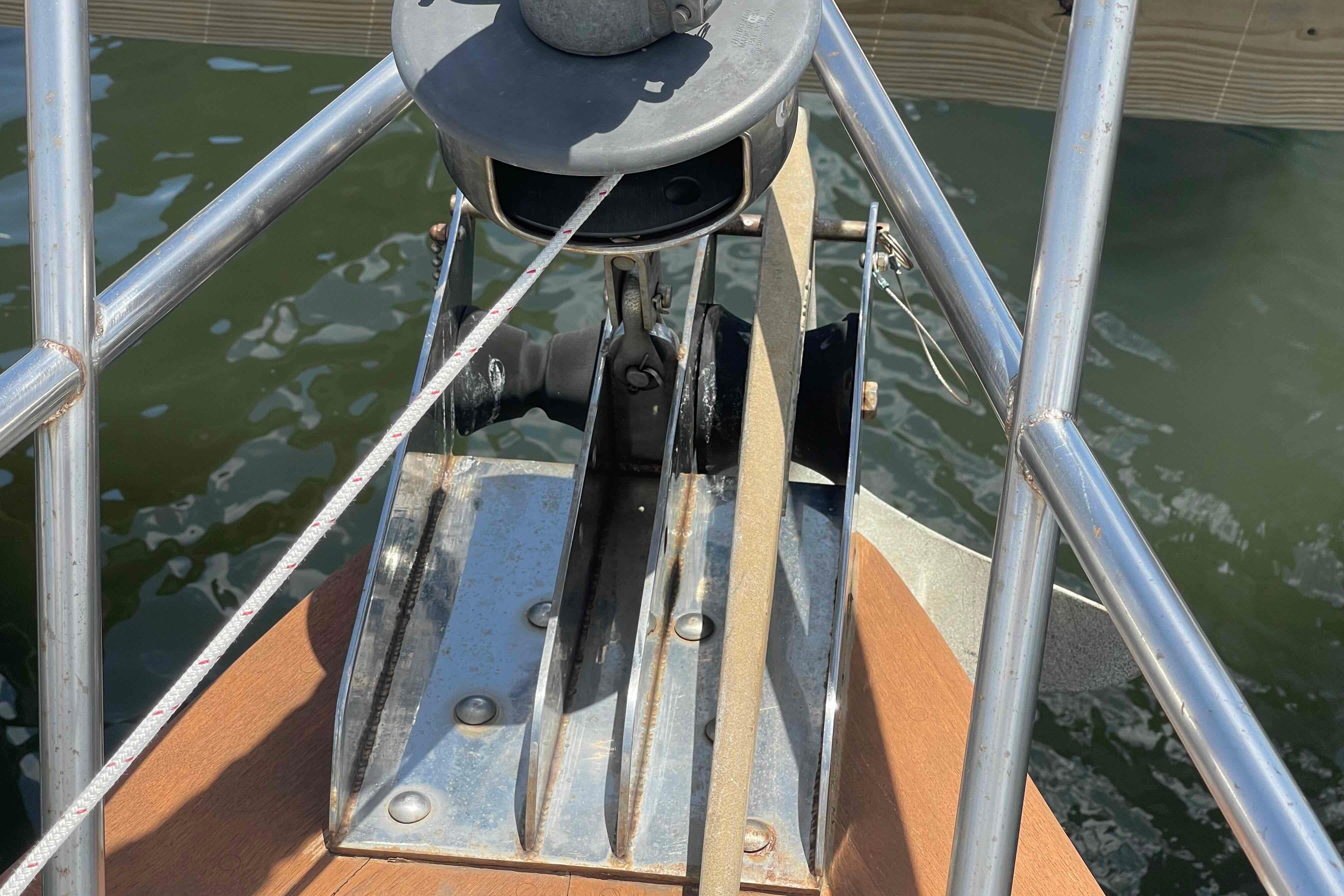 Bow of 1987 Pacific Seacraft 34 sailboat with anchor and rigging details.