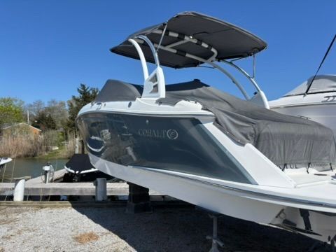 2020 Cobalt SC23 boat with cover at dock.