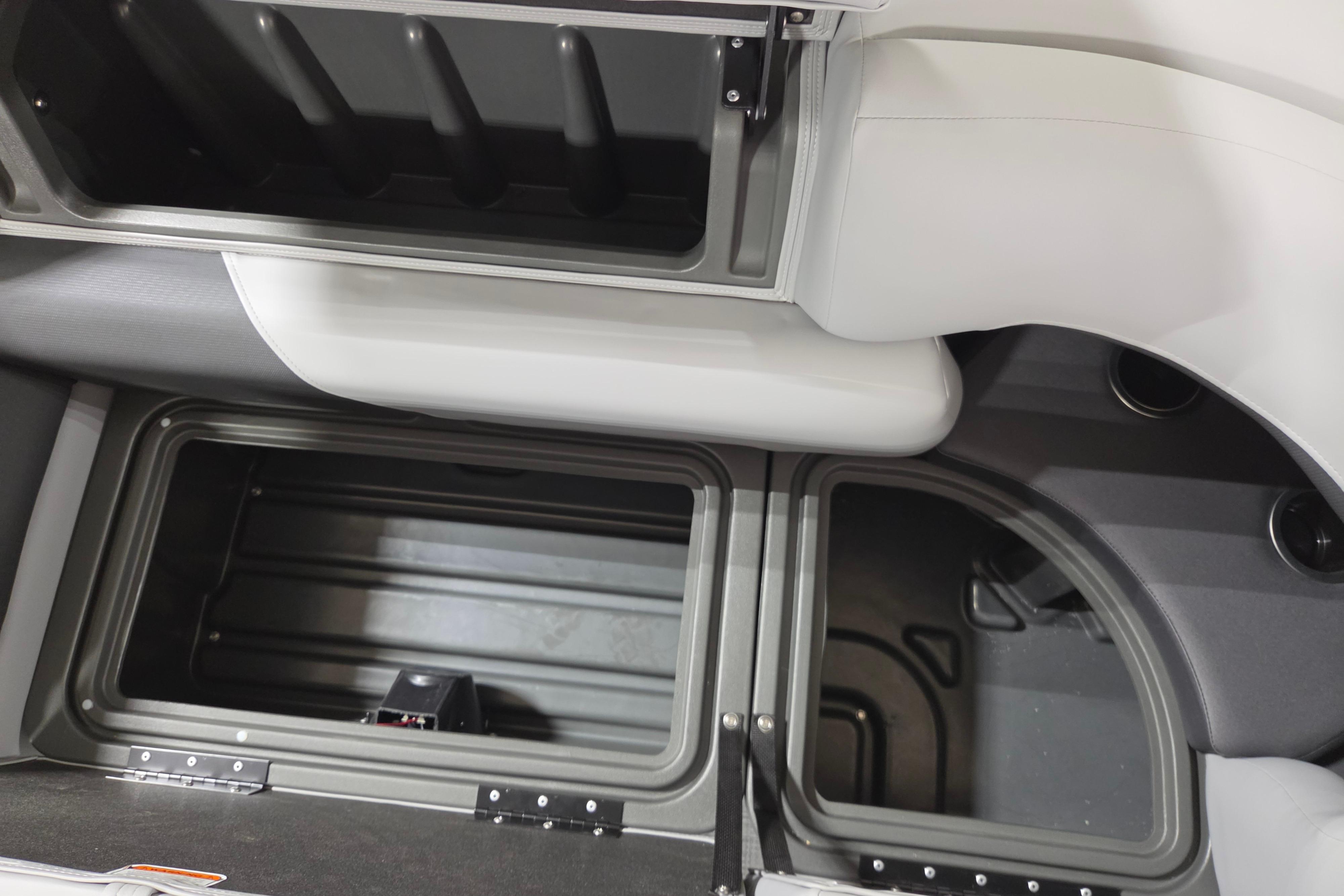 Storage compartments in a 2026 Sun Tracker Party Barge 20 DLX pontoon boat.