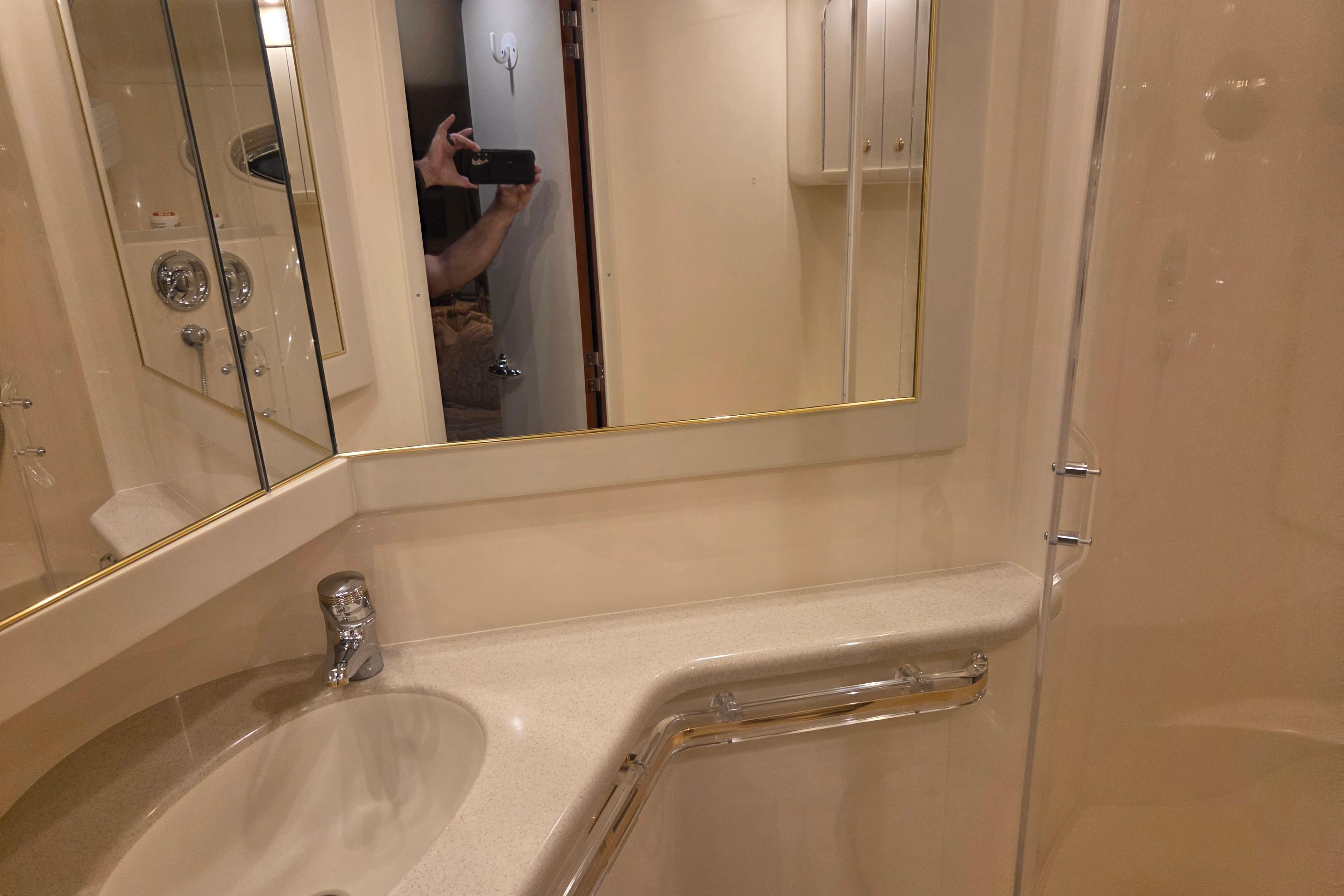 Bathroom interior of 2000 Sea Ray Sundancer 540 yacht, featuring sink and mirror.