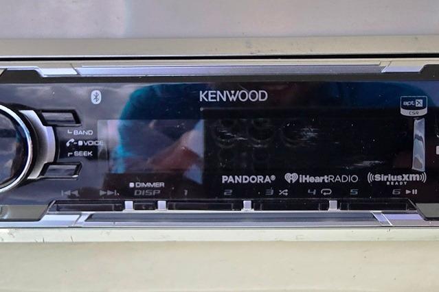 Kenwood stereo system in a 2006 Sea Ray 185 Sport boat dashboard.