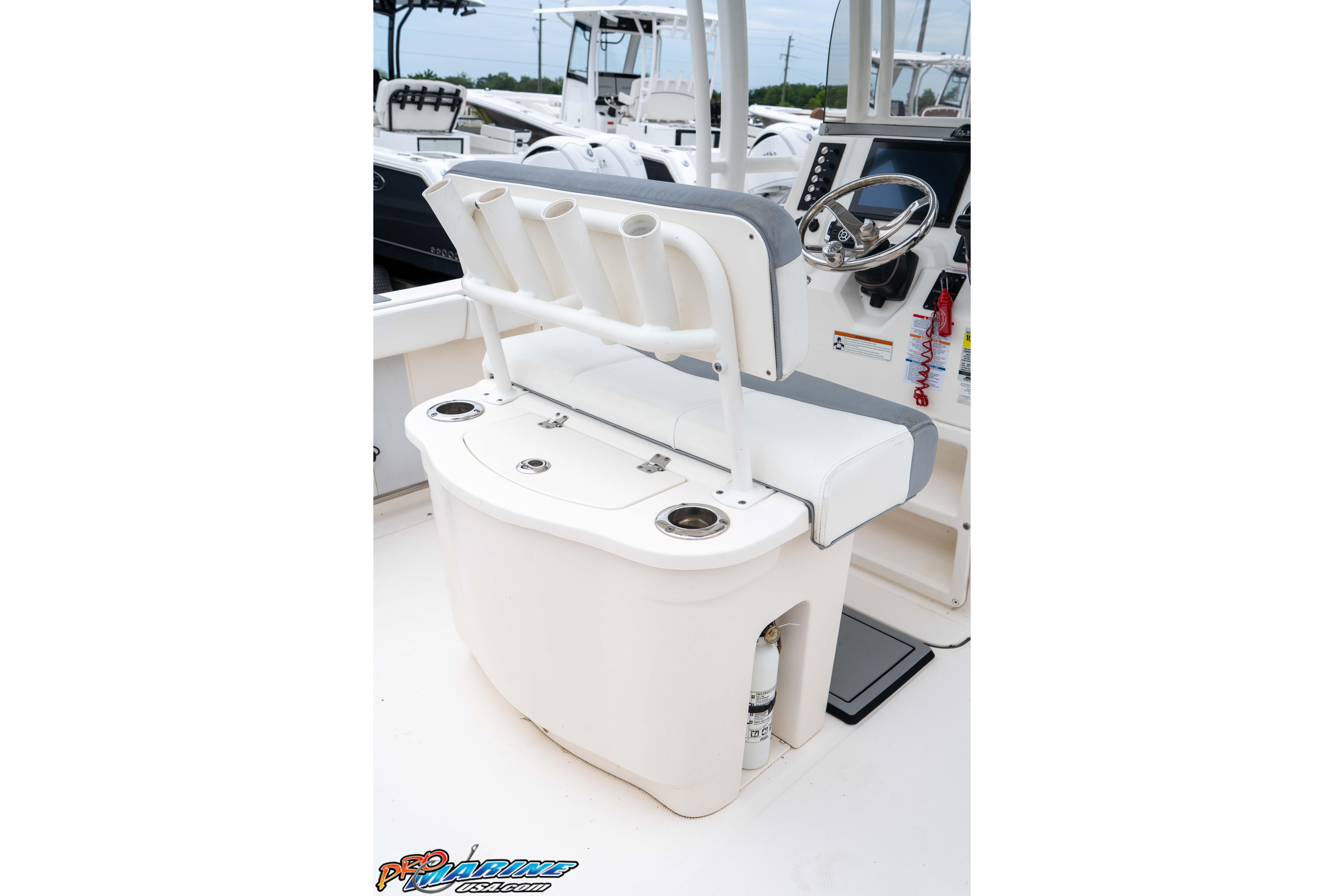 2021 Robalo R222 Center Console boat interior with helm and seating area.
