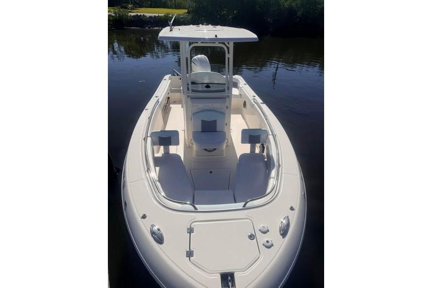 2020 Robalo R242 Explorer boat on calm water, showcasing sleek design and spacious deck.
