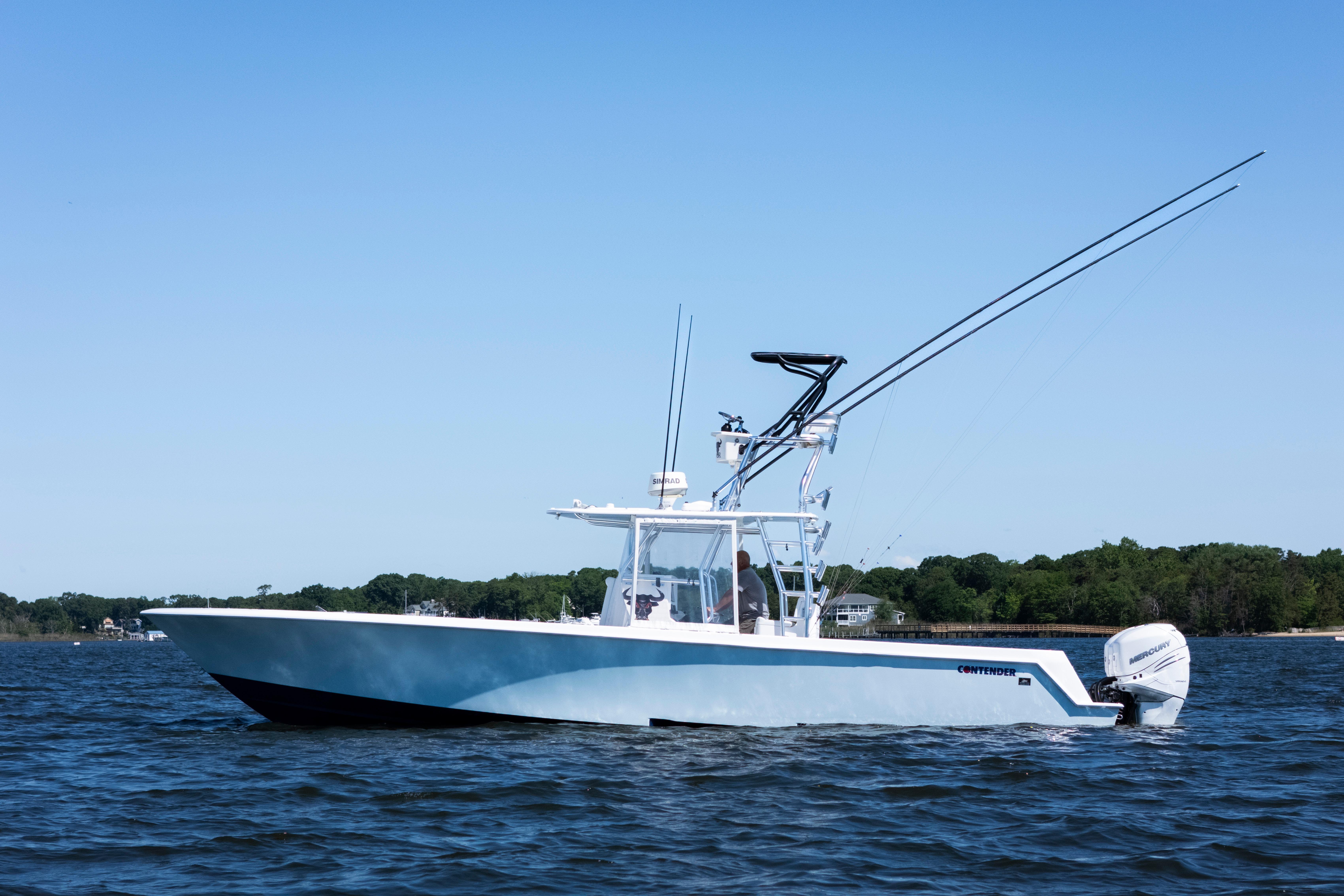 2015 Contender 39 ST boat on water, featuring sleek design and powerful outboard engines.