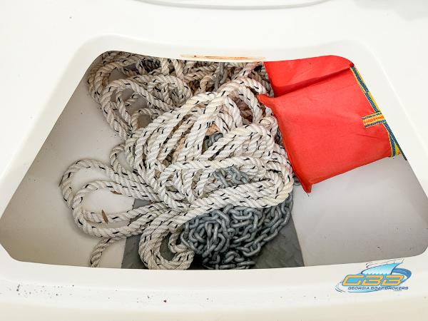 Storage compartment with rope and chain on a 2008 Sea Ray 270 SLX boat.
