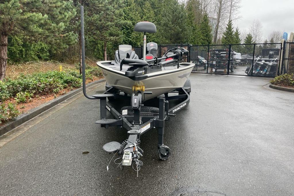 2025 Tracker Savage 215 boat on trailer in outdoor setting.