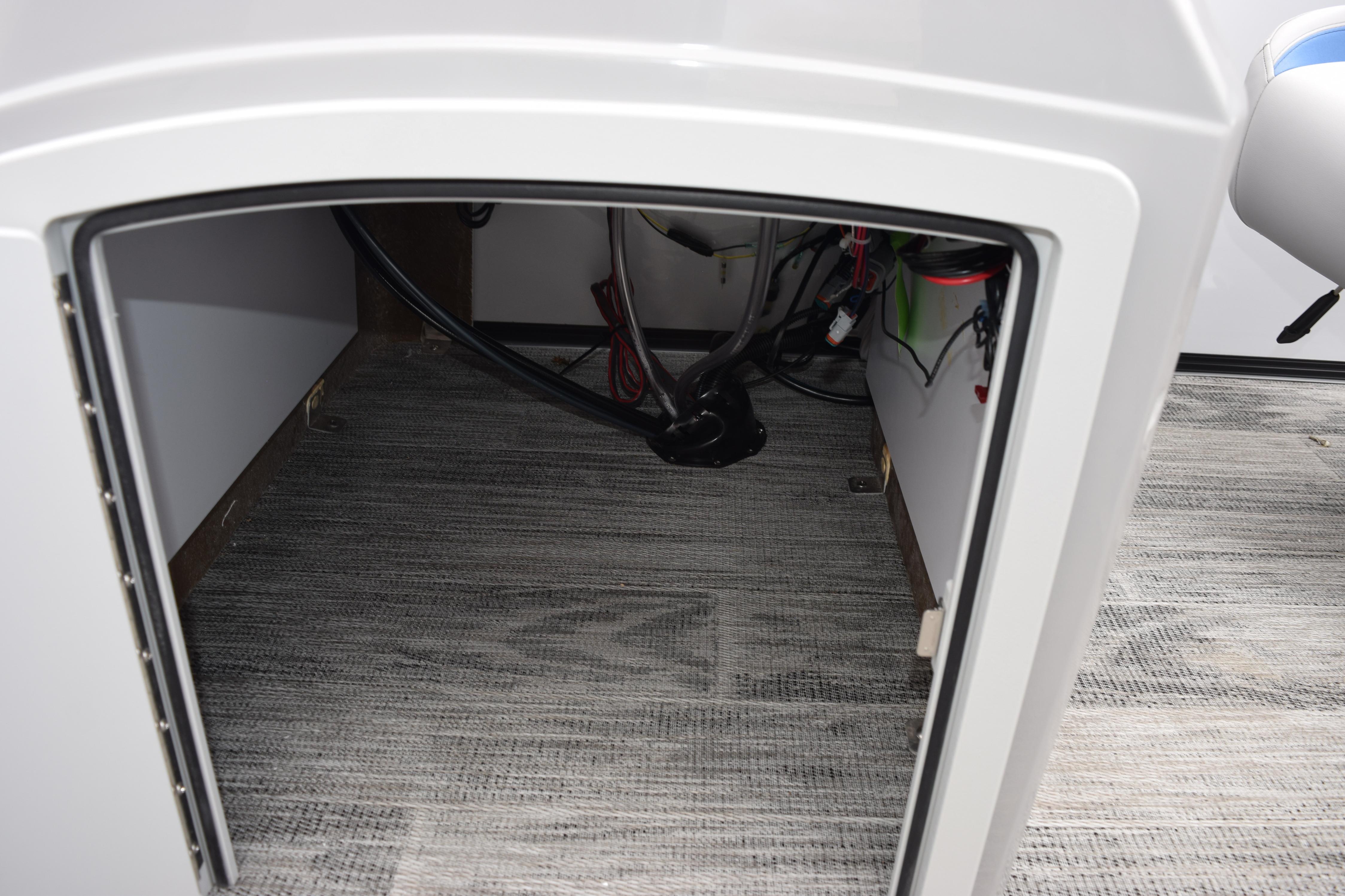 Interior view of 2026 Bentley Pontoons Bolt 223 storage compartment with wiring.