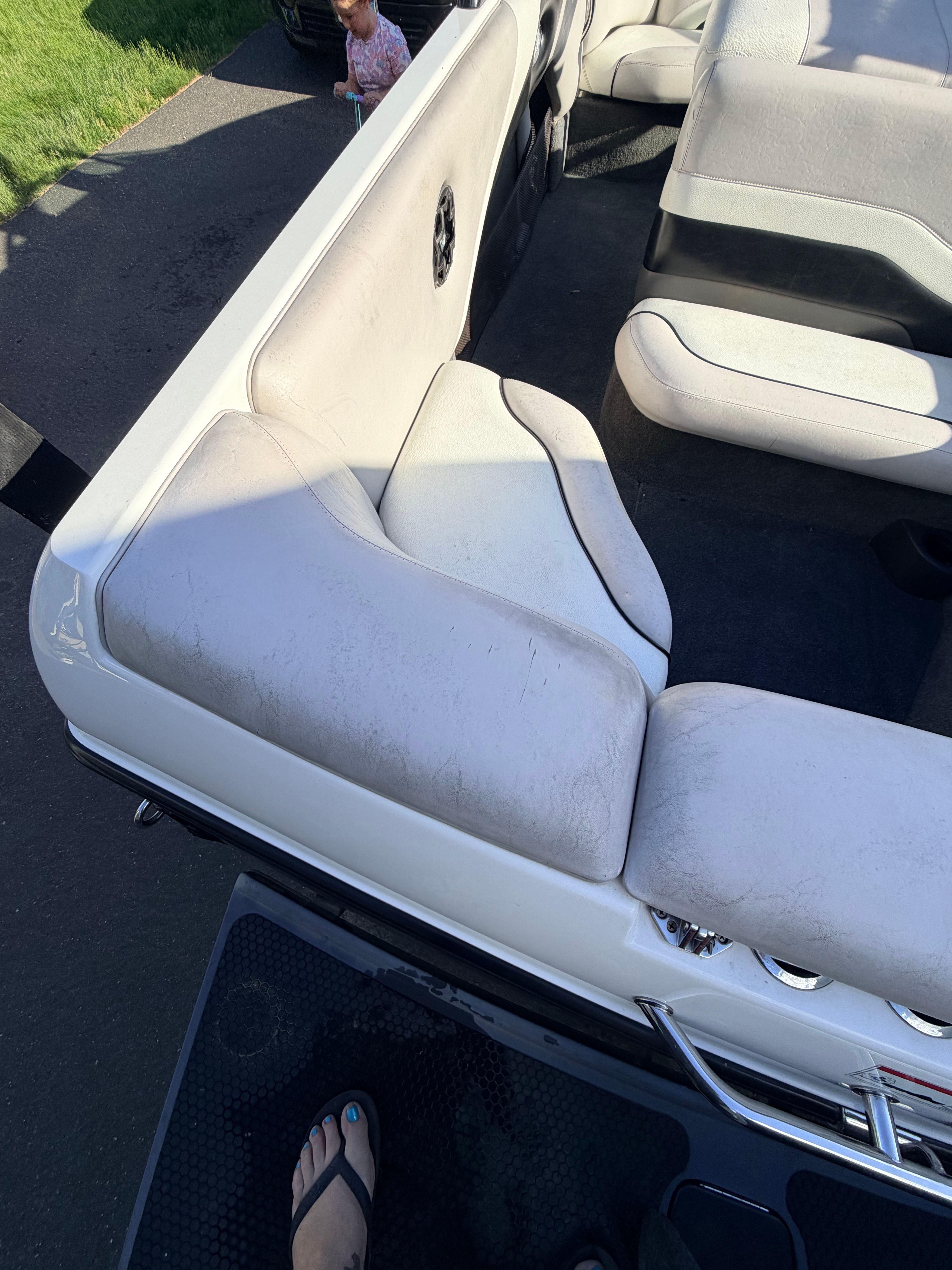 Interior of a 2006 Malibu iRide boat with white seats.