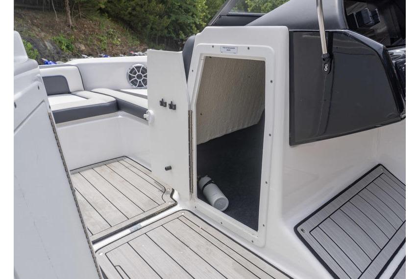2021 Yamaha Boats 195S interior with open storage compartment and seating area.