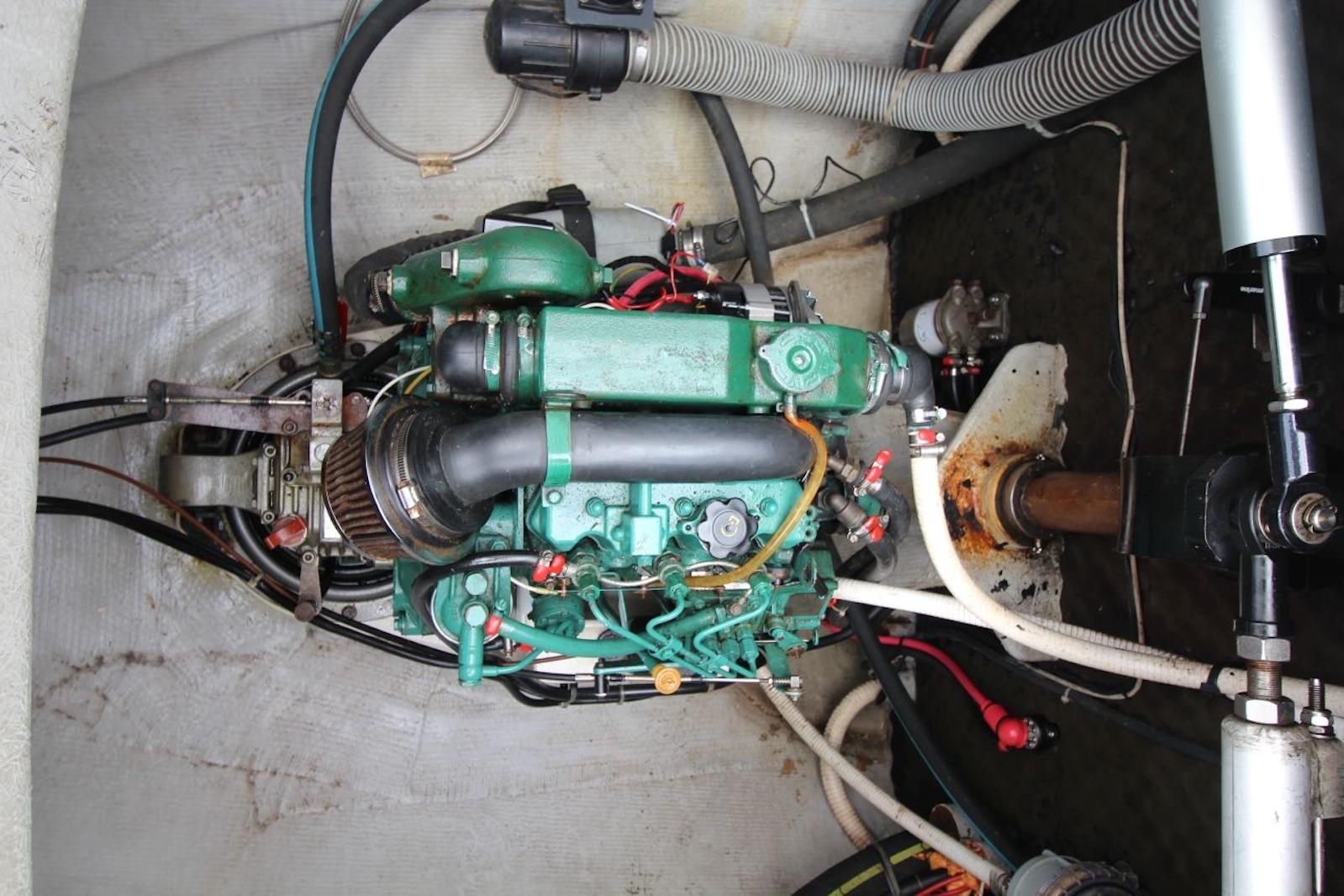 Engine compartment of a 2004 Lagoon 380 catamaran, showcasing mechanical components and wiring.