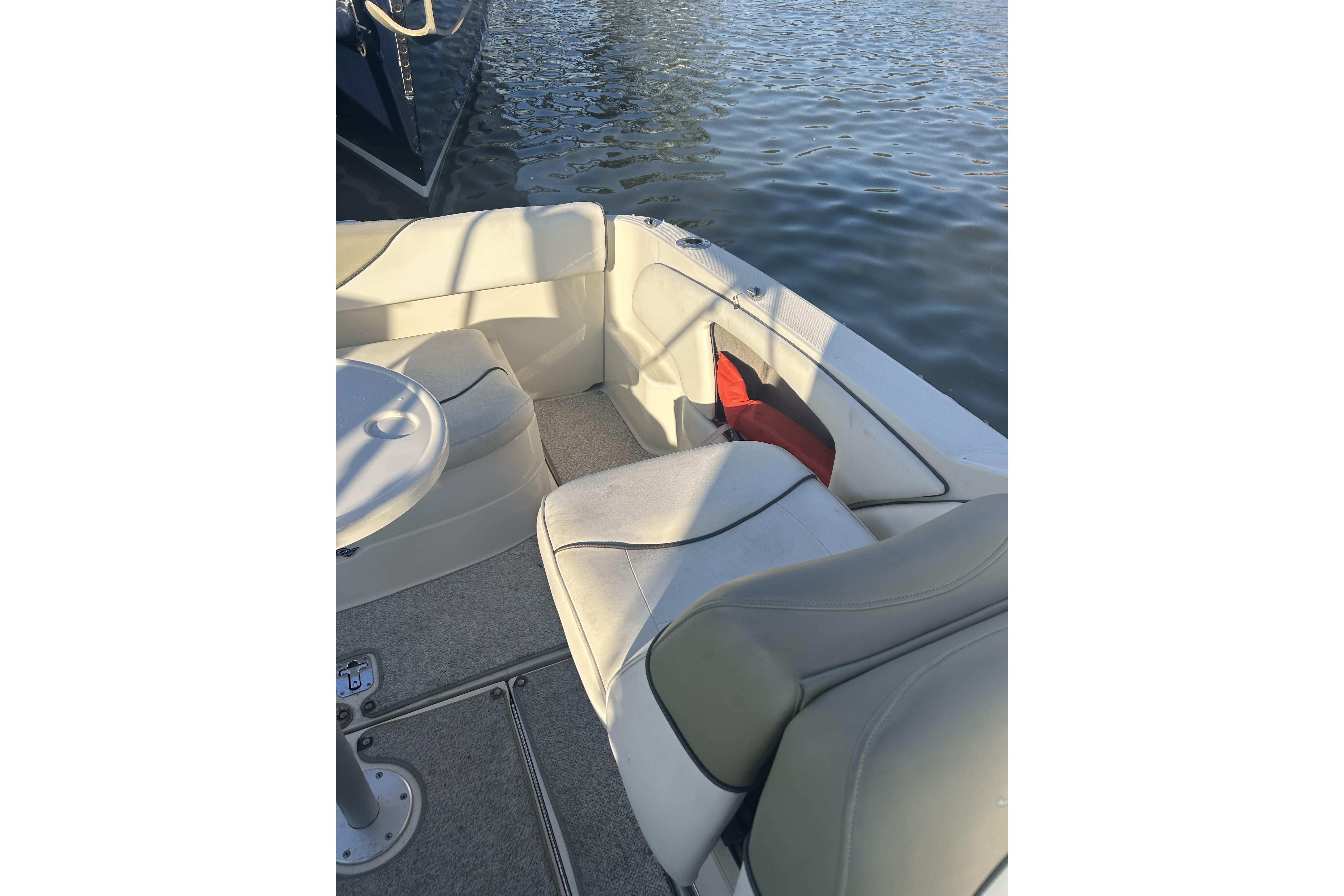 Interior of 2007 Sea Ray 250 Amberjack with seating area.