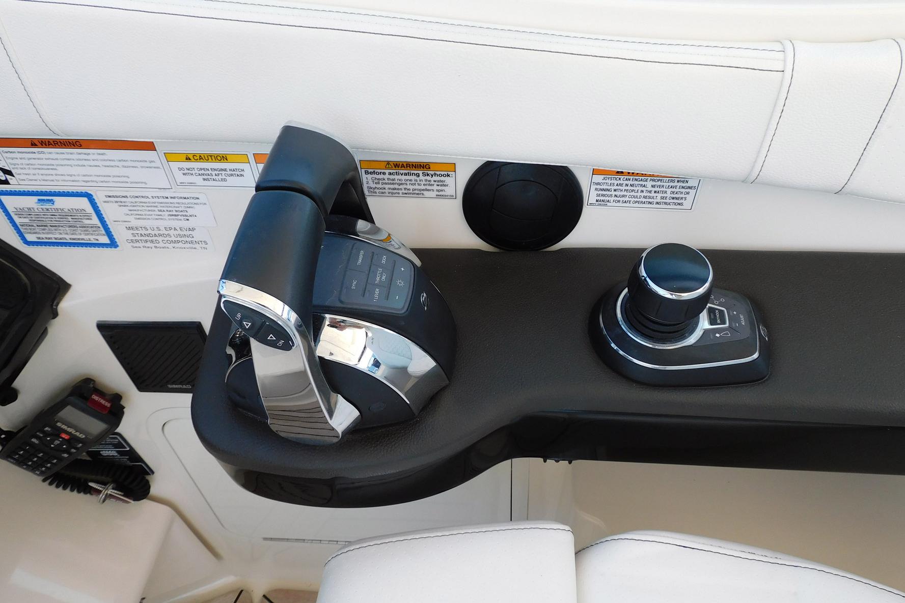 Control panel of 2018 Sea Ray Sundancer 320 boat with throttle and joystick.