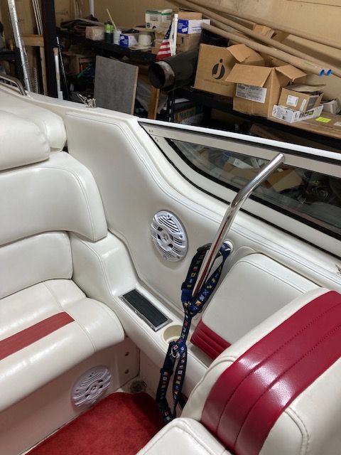 Interior of a 2001 Fountain Lightning boat with white and red seating.