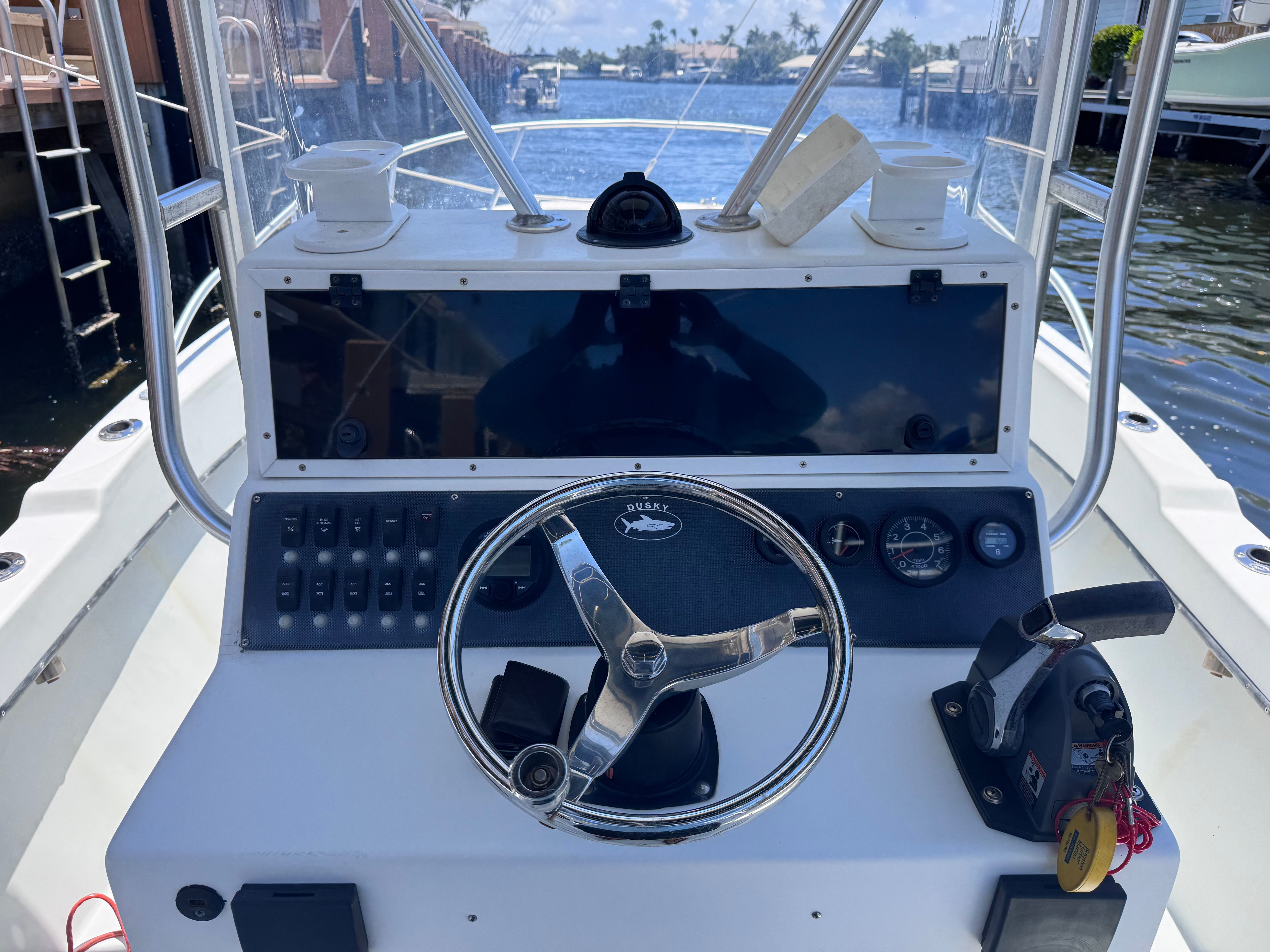 1998 Dusky 20.3 boat helm with harbor view.