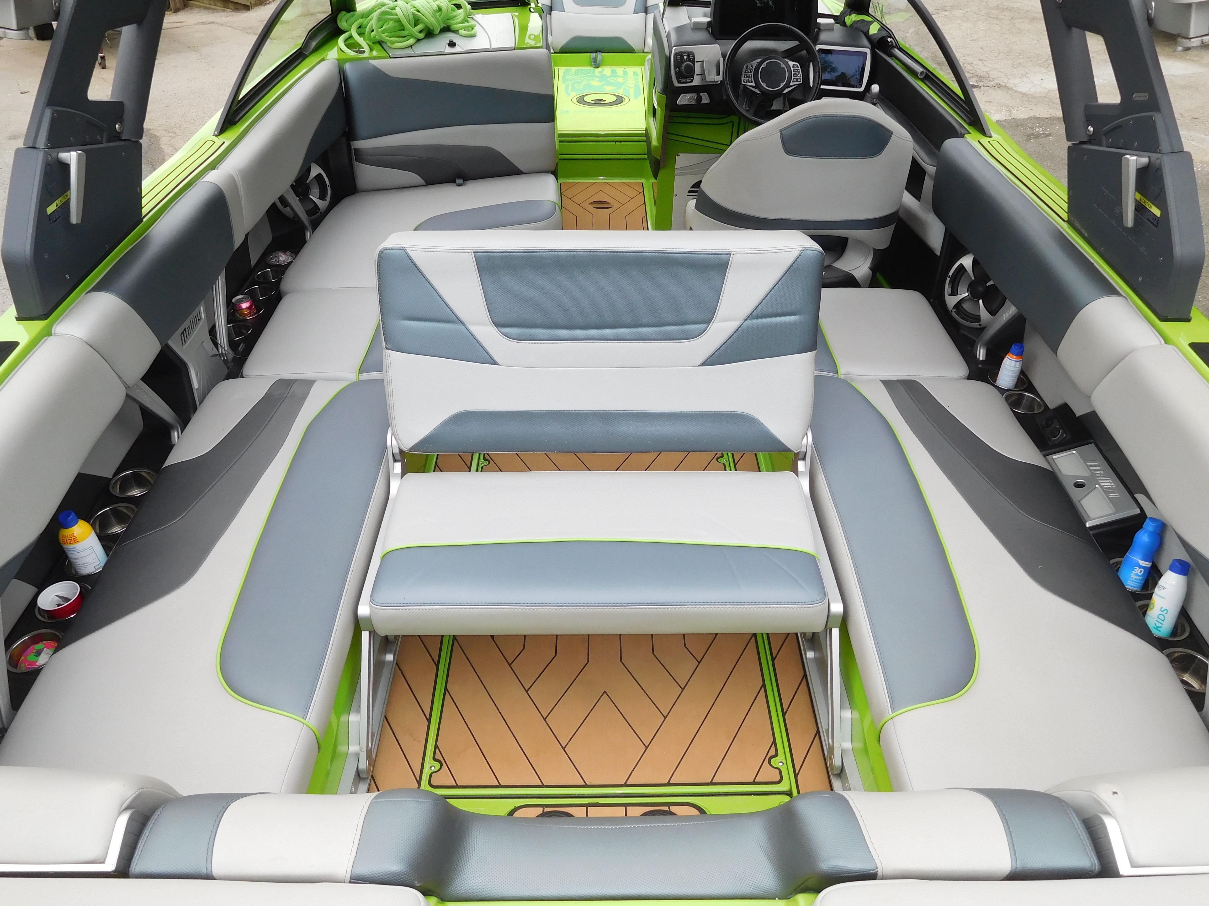 2017 Malibu Wakesetter 24 MXZ interior with gray and green seating.