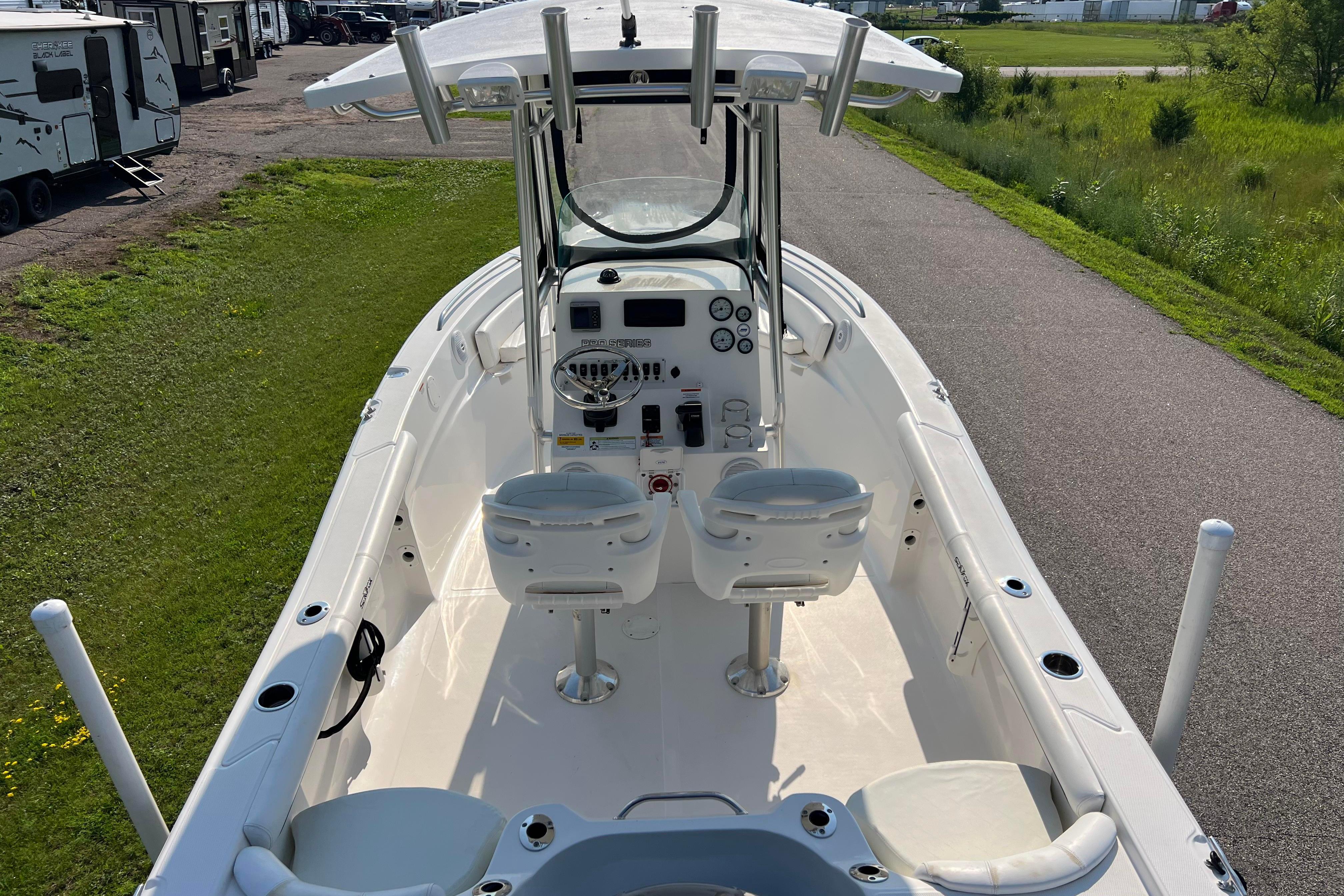 2012 Sea Fox 206 Center Console boat with dual seats and steering console.