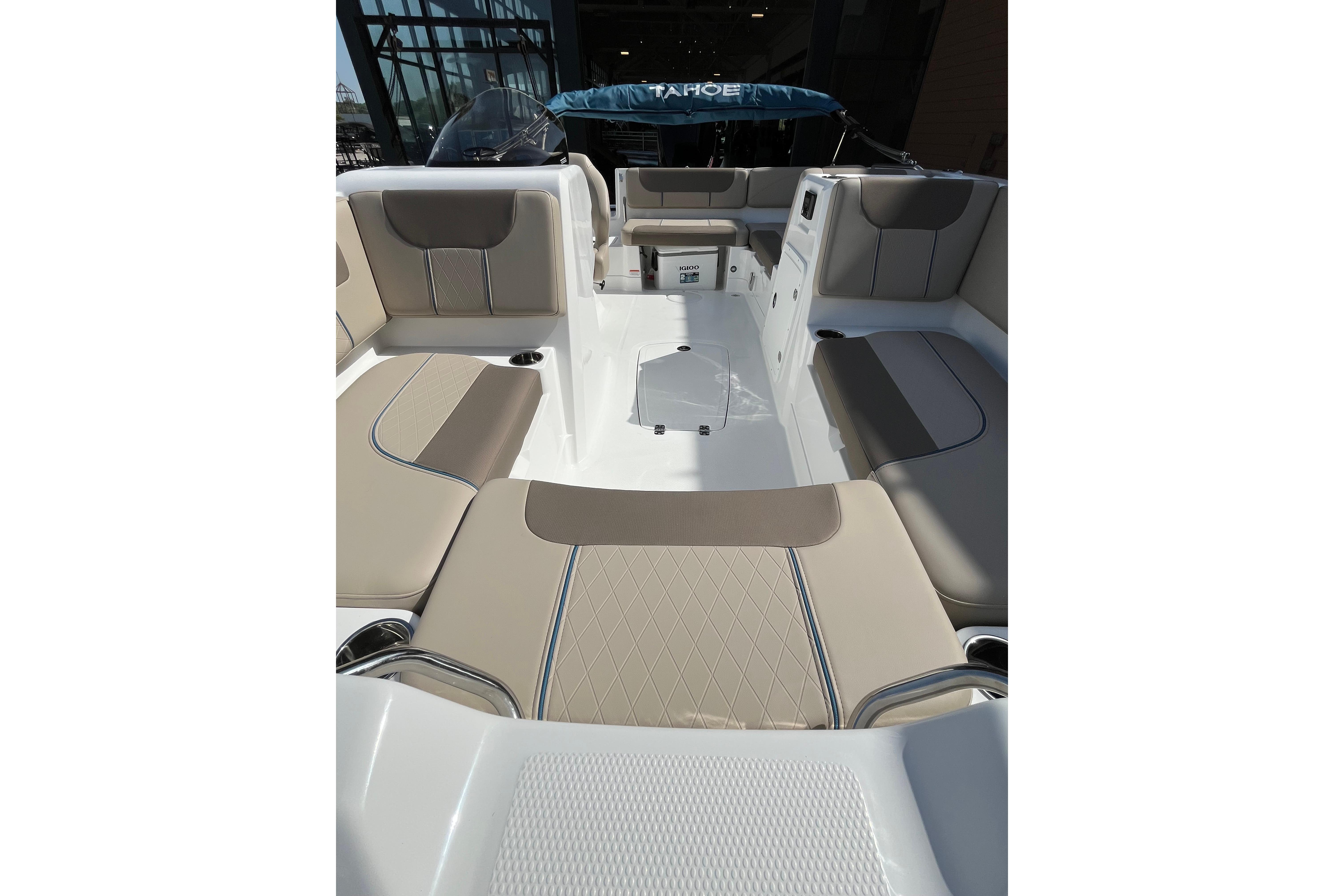 Interior view of 2026 Tahoe 1950 boat with beige seating and modern design.
