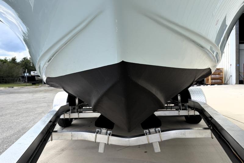 2024 Key West 239 FS boat on trailer, showcasing sleek hull design.